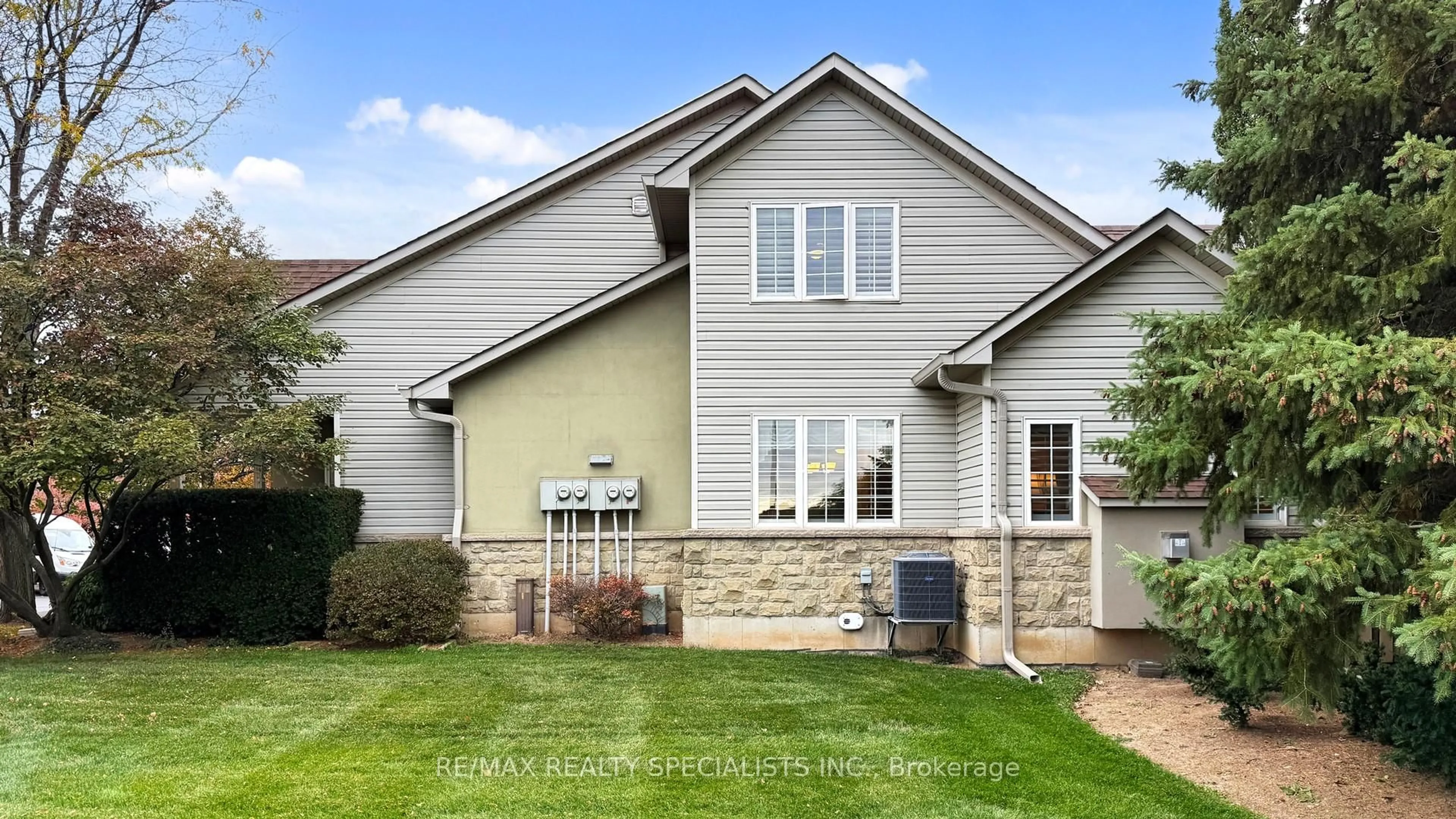 Home with vinyl exterior material, street for 212 Stonehenge Dr #1, Hamilton Ontario L9K 1N5