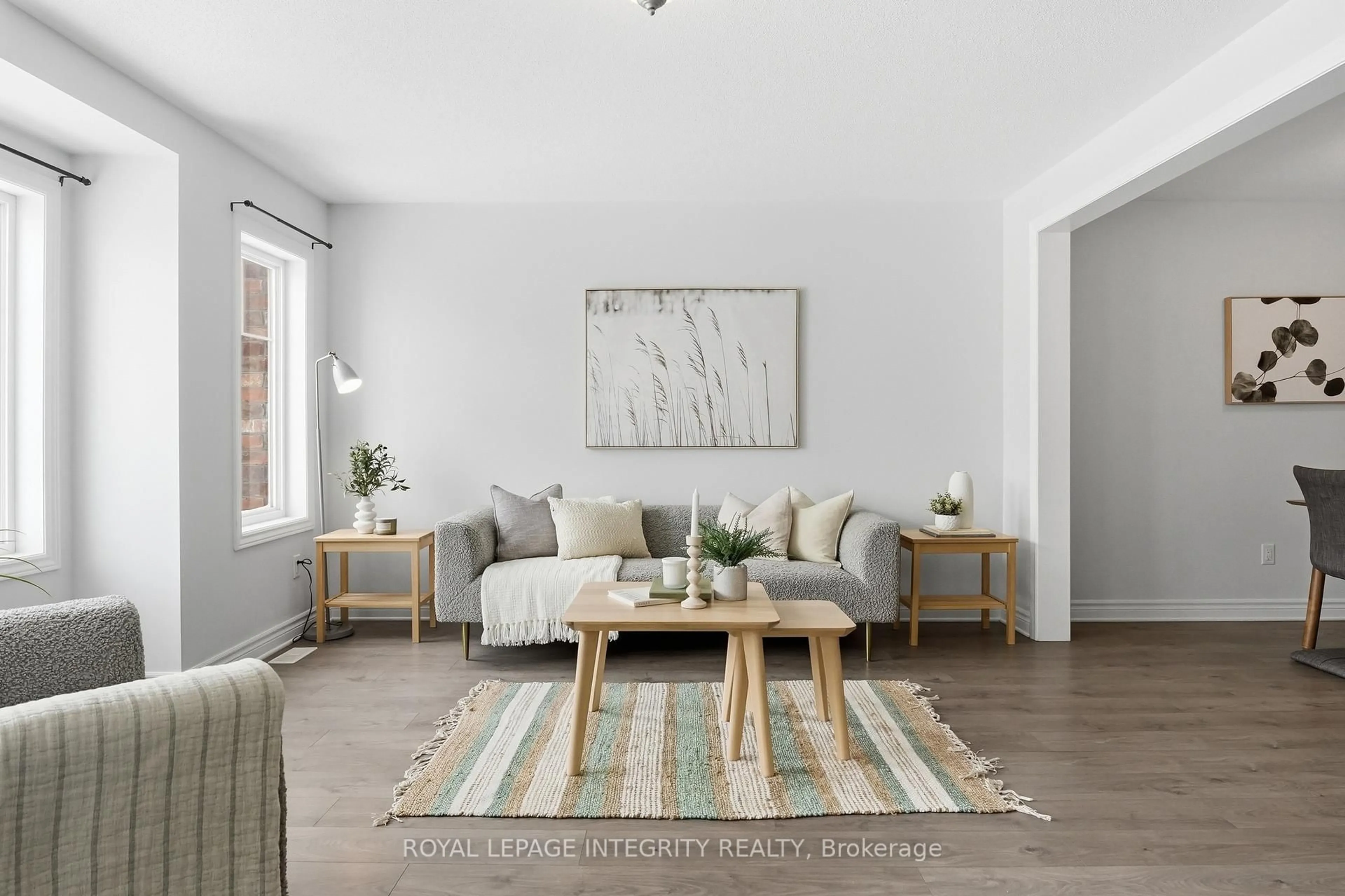 Living room with furniture, wood/laminate floor for 145 Gelderland Private, Ottawa Ontario K2V 0H8