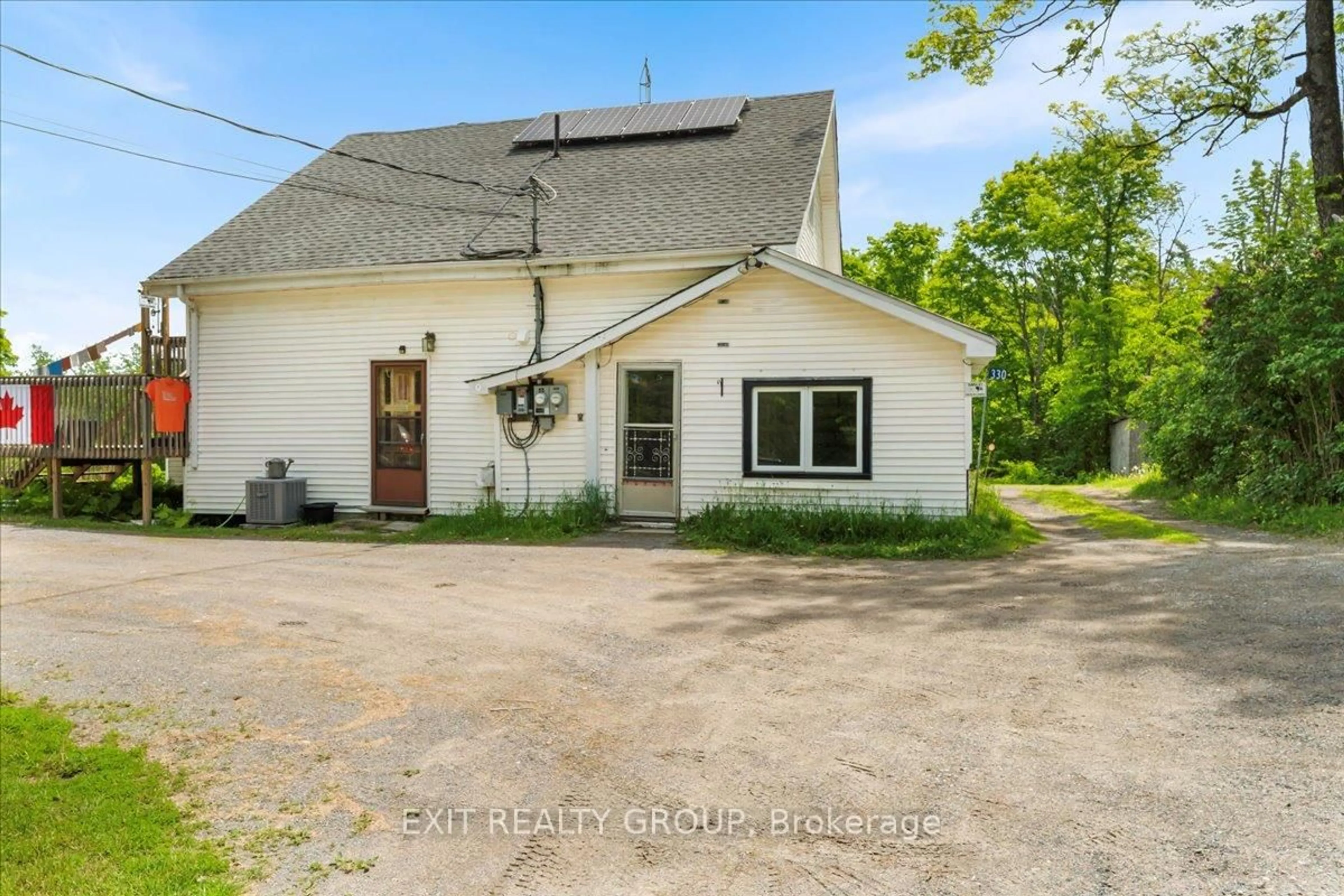 A pic from outside/outdoor area/front of a property/back of a property/a pic from drone, street for 330 Black River Rd, Tweed Ontario K0K 3J0