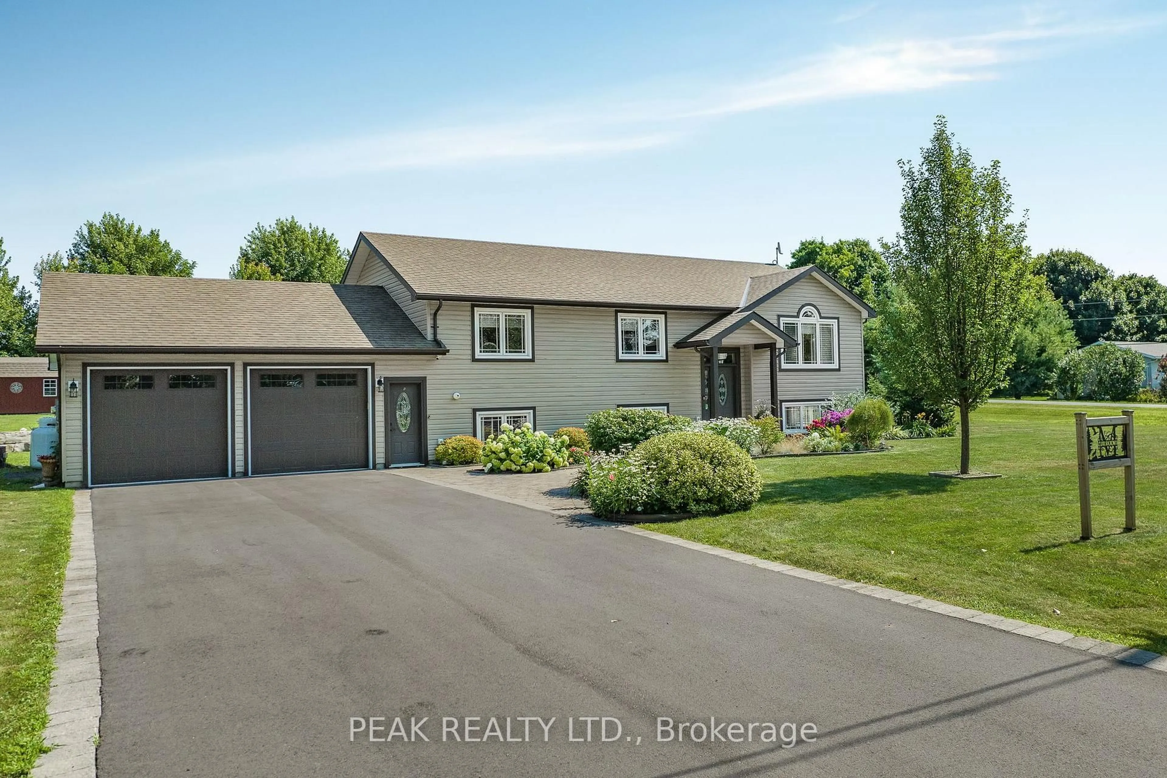 Home with vinyl exterior material, street for 116 Prinyers Cove Cres, Prince Edward County Ontario K0K 2T0