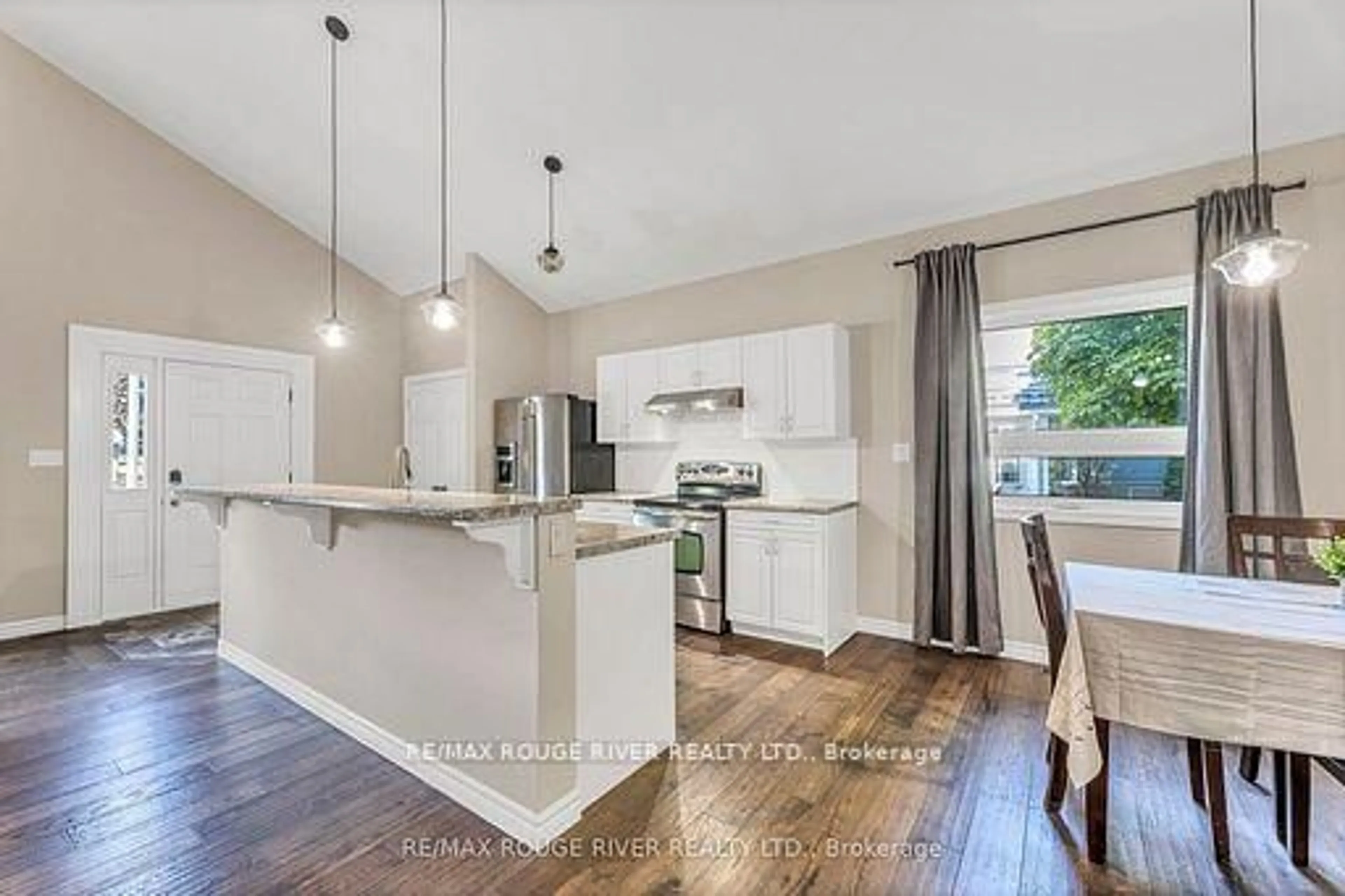 Open concept kitchen, wood/laminate floor for 100 Queen St, Kawartha Lakes Ontario K0M 1N0