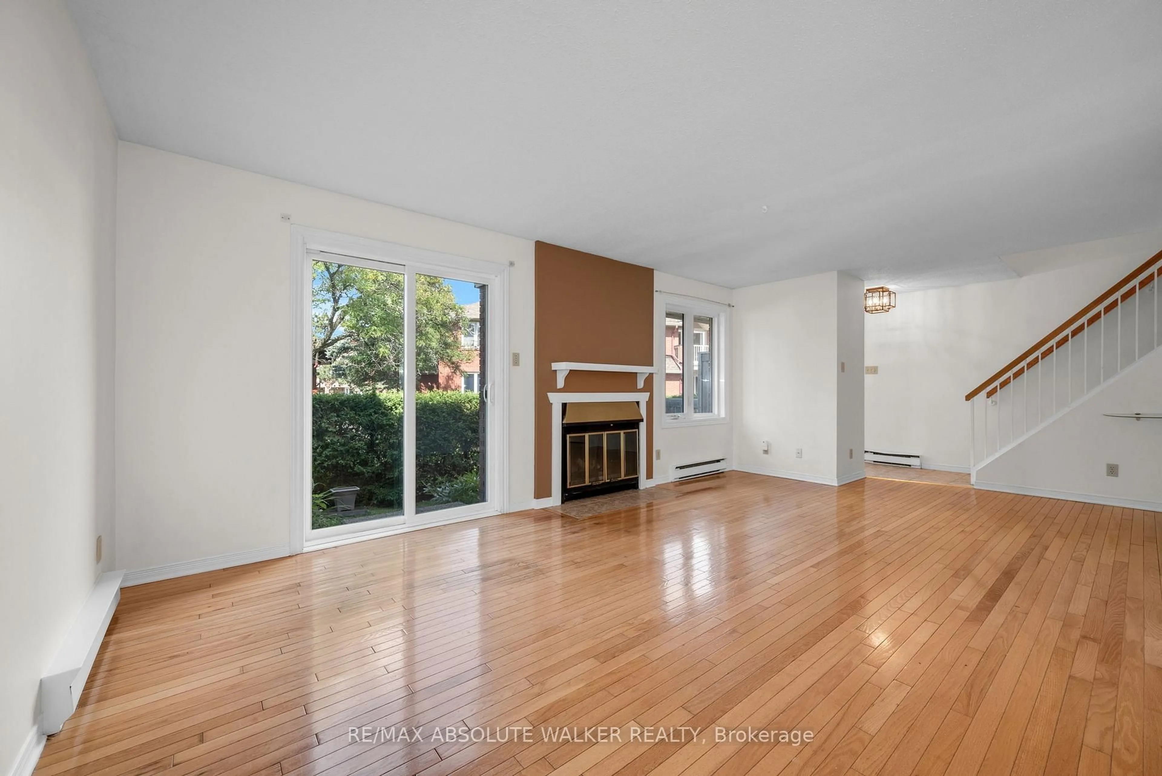 Living room with furniture, wood/laminate floor for 500 Canteval Terr #108, Orleans Ontario K4A 2C8