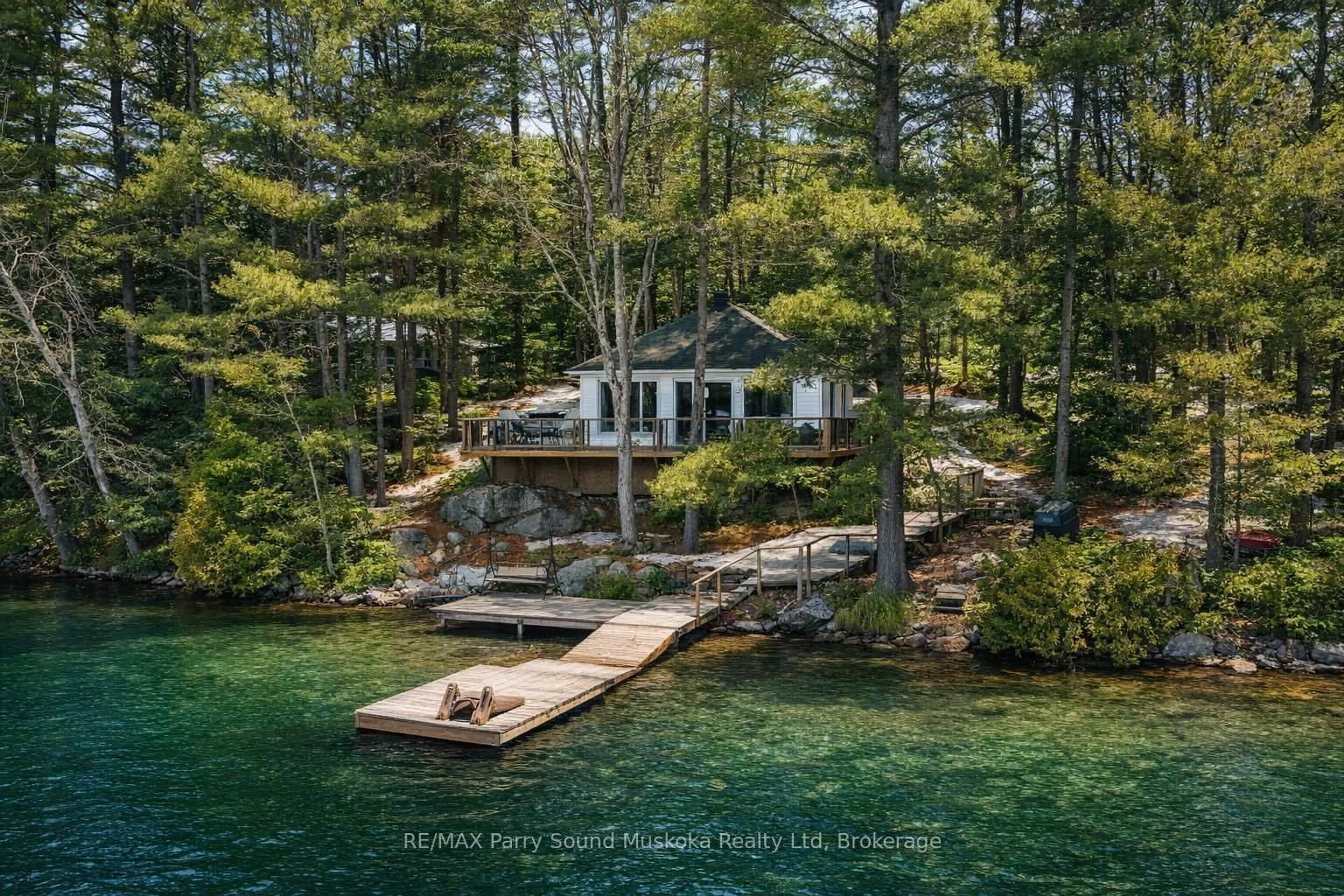 A pic from outside/outdoor area/front of a property/back of a property/a pic from drone, water/lake/river/ocean view for 4 Post Lane, Seguin Ontario P2A 2W8