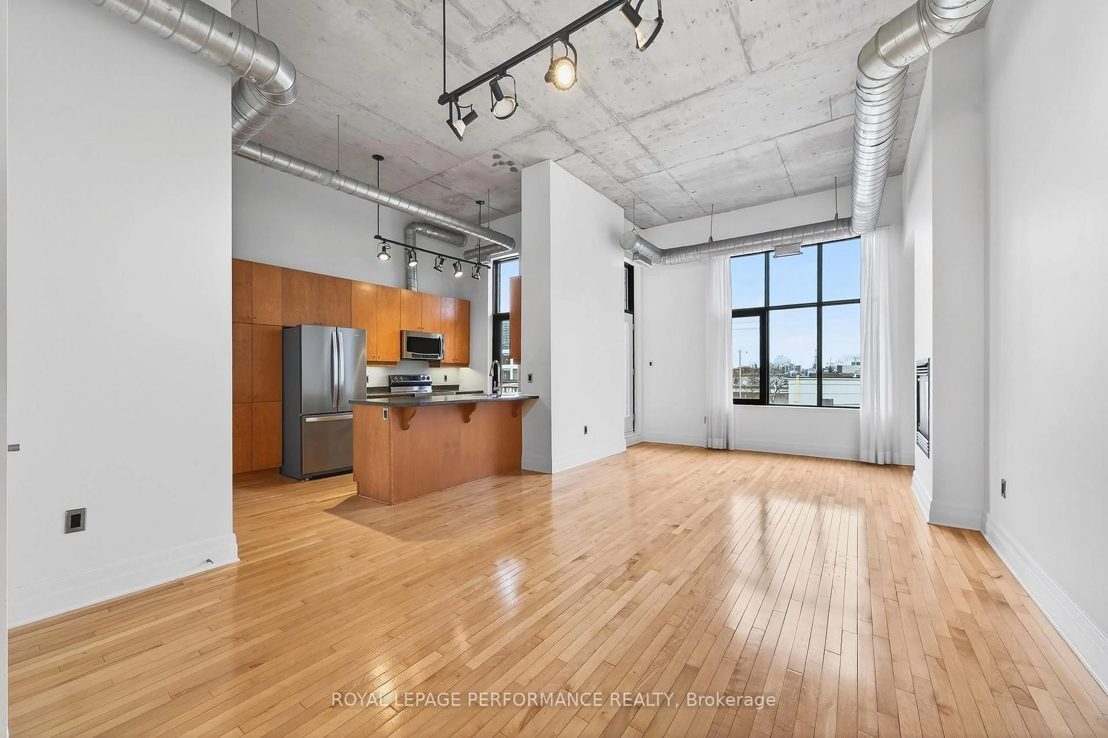 Open concept kitchen, cement floor for 420 Berkley Ave #302, Ottawa Ontario K2A 4H5