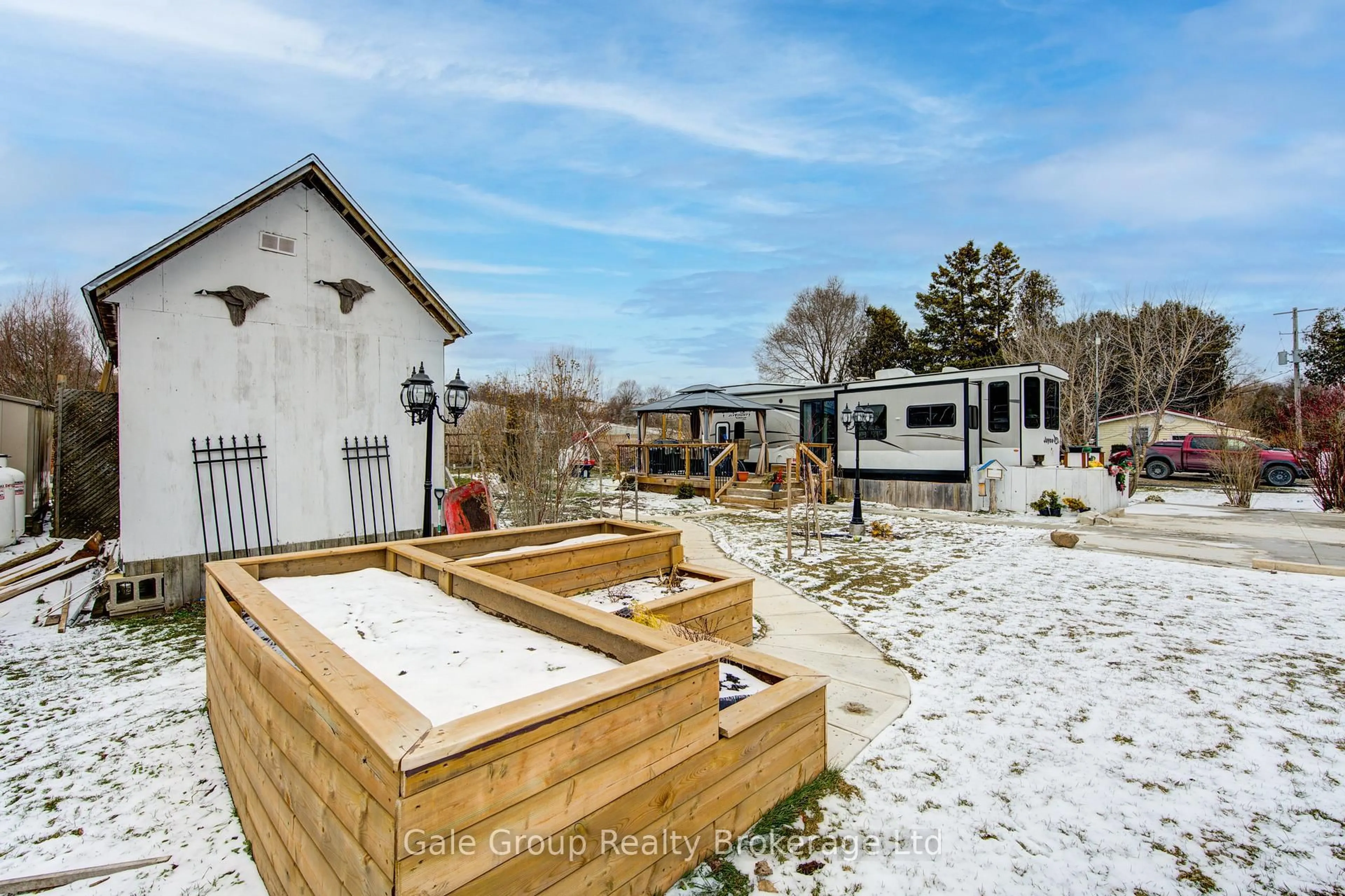 A pic from outside/outdoor area/front of a property/back of a property/a pic from drone, unknown for 495856 10th Line #92, East Zorra-Tavistock Ontario N4S 7V7