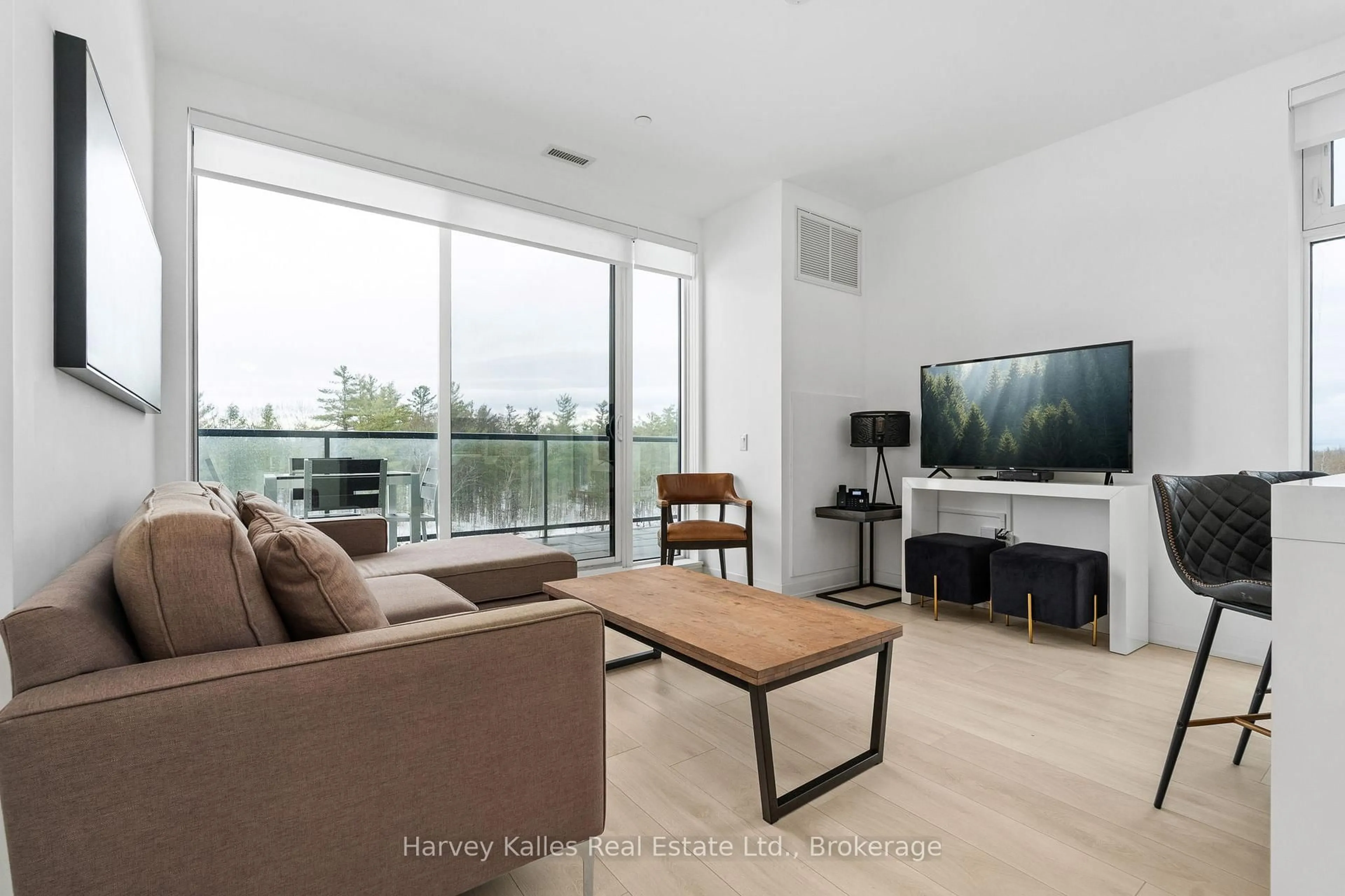 Living room with furniture, unknown for 120 Carrick Tr #401, Gravenhurst Ontario P1P 0B6