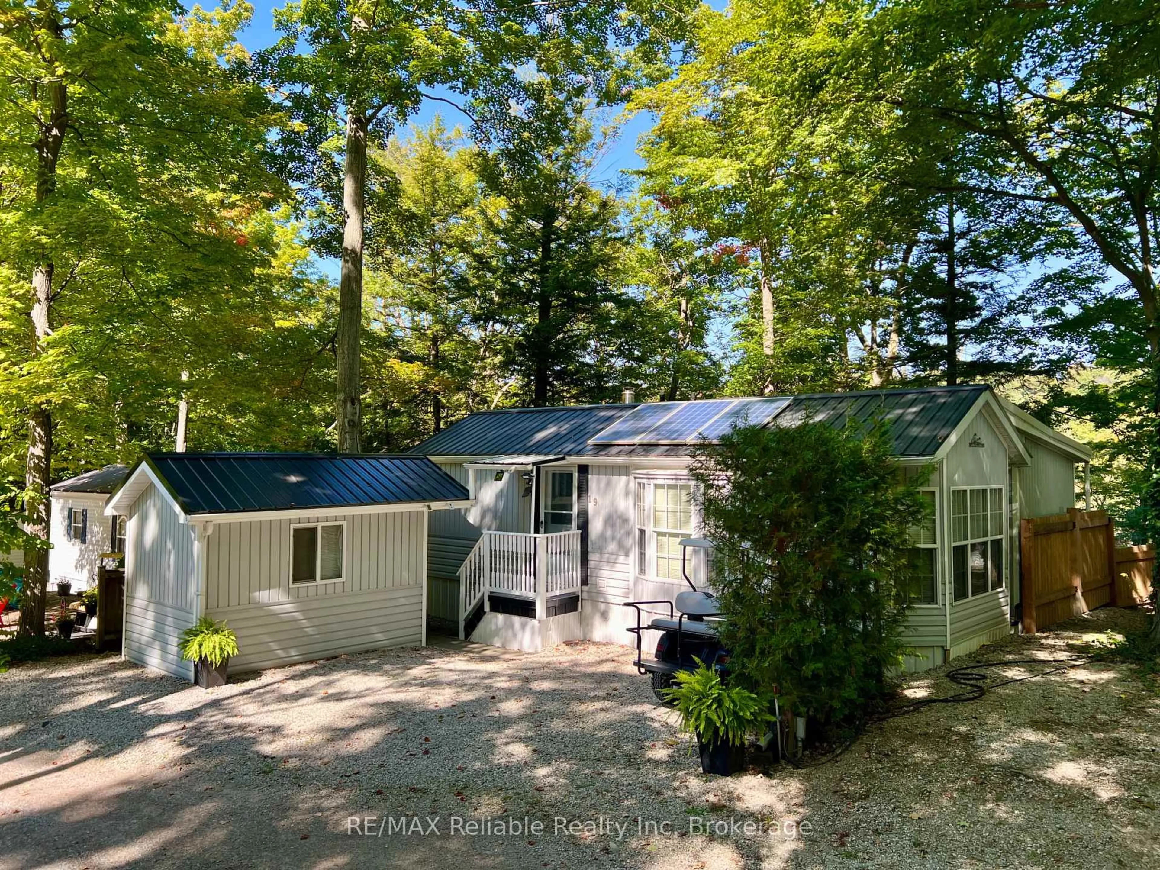 A pic from outside/outdoor area/front of a property/back of a property/a pic from drone, forest/trees view for 76735 Wildwood Line #19, Bluewater Ontario N0M 1G0