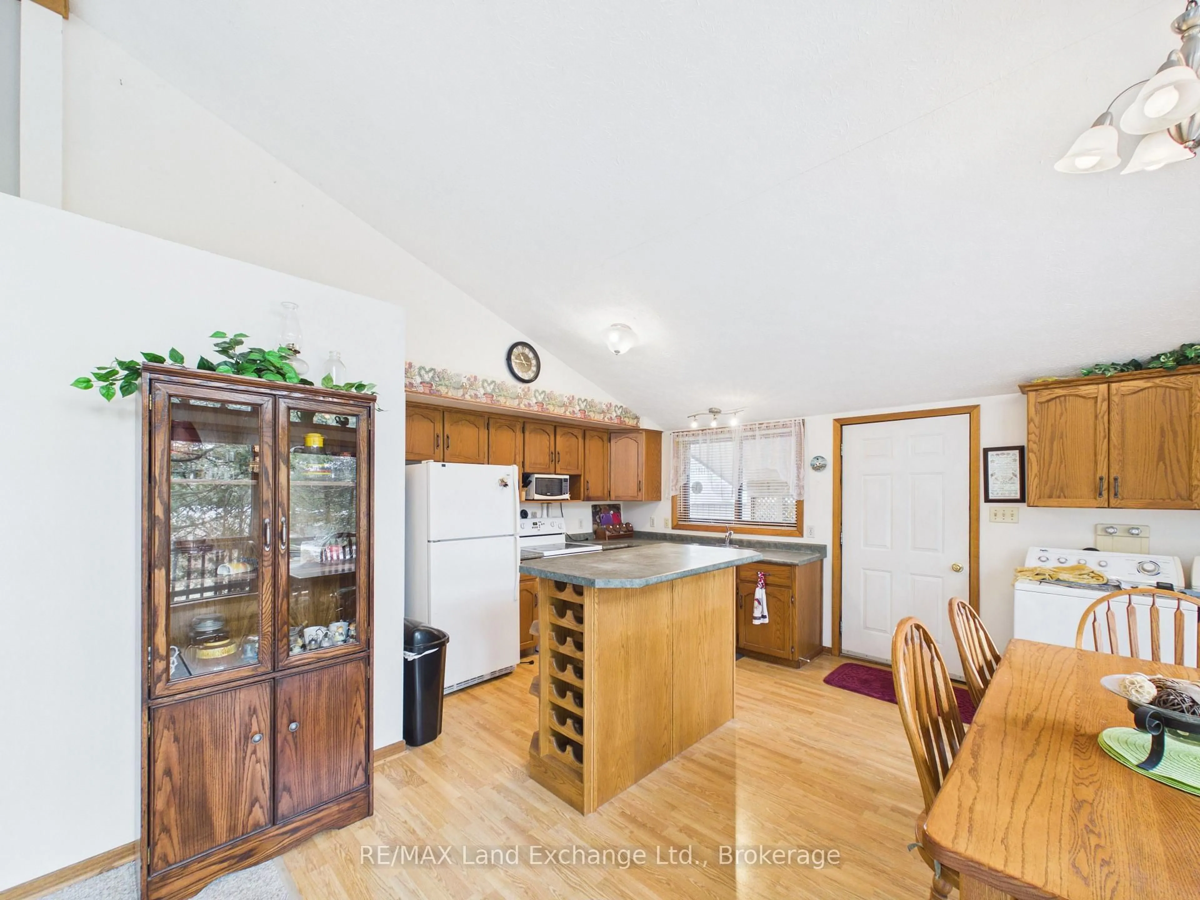 Open concept kitchen, wood/laminate floor for 144 Bell Dr, Huron-Kinloss Ontario N2Z 0B3