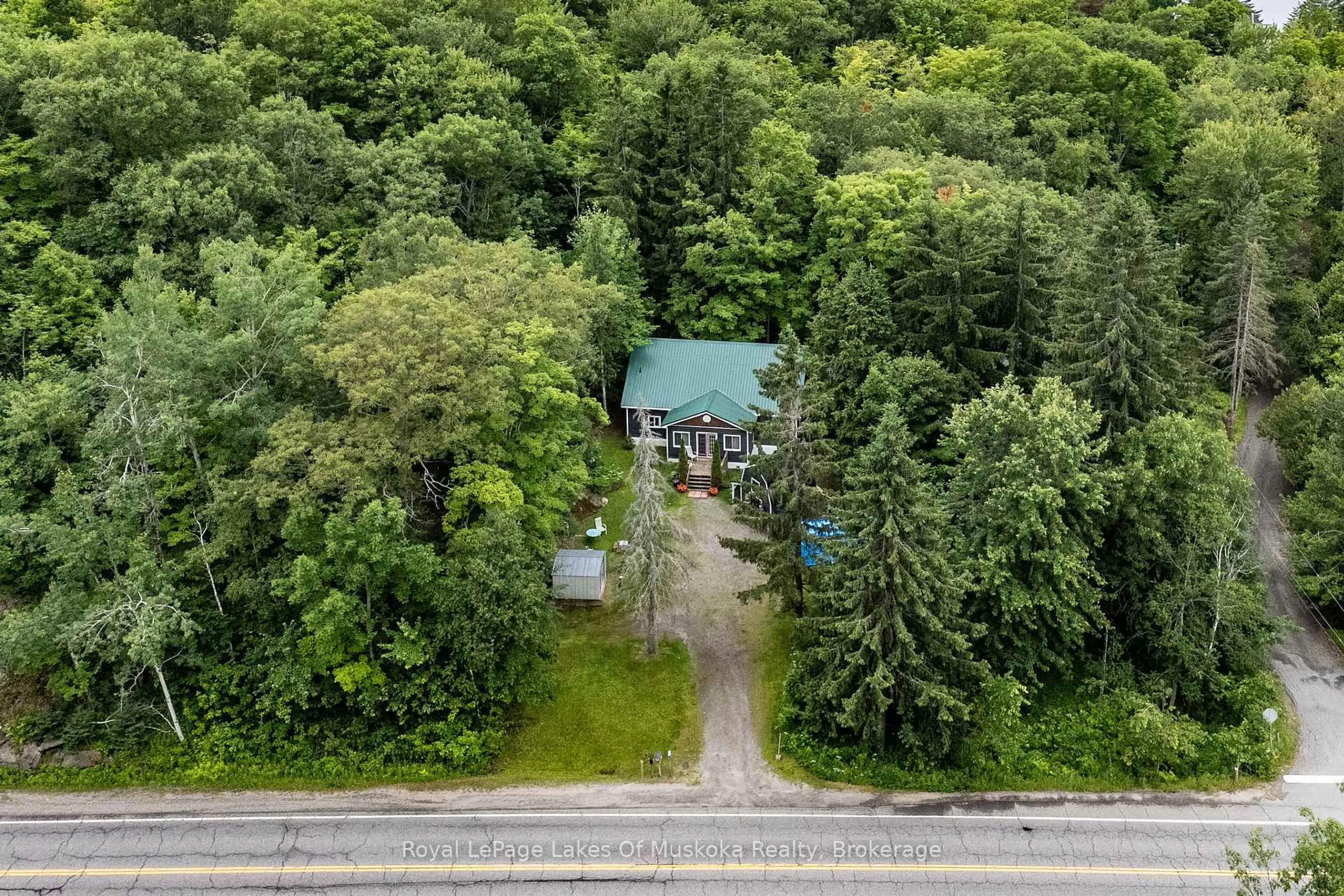 A pic from outside/outdoor area/front of a property/back of a property/a pic from drone, forest/trees view for 2709 Muskoka District 118 Rd, Muskoka Lakes Ontario P0B 1J0