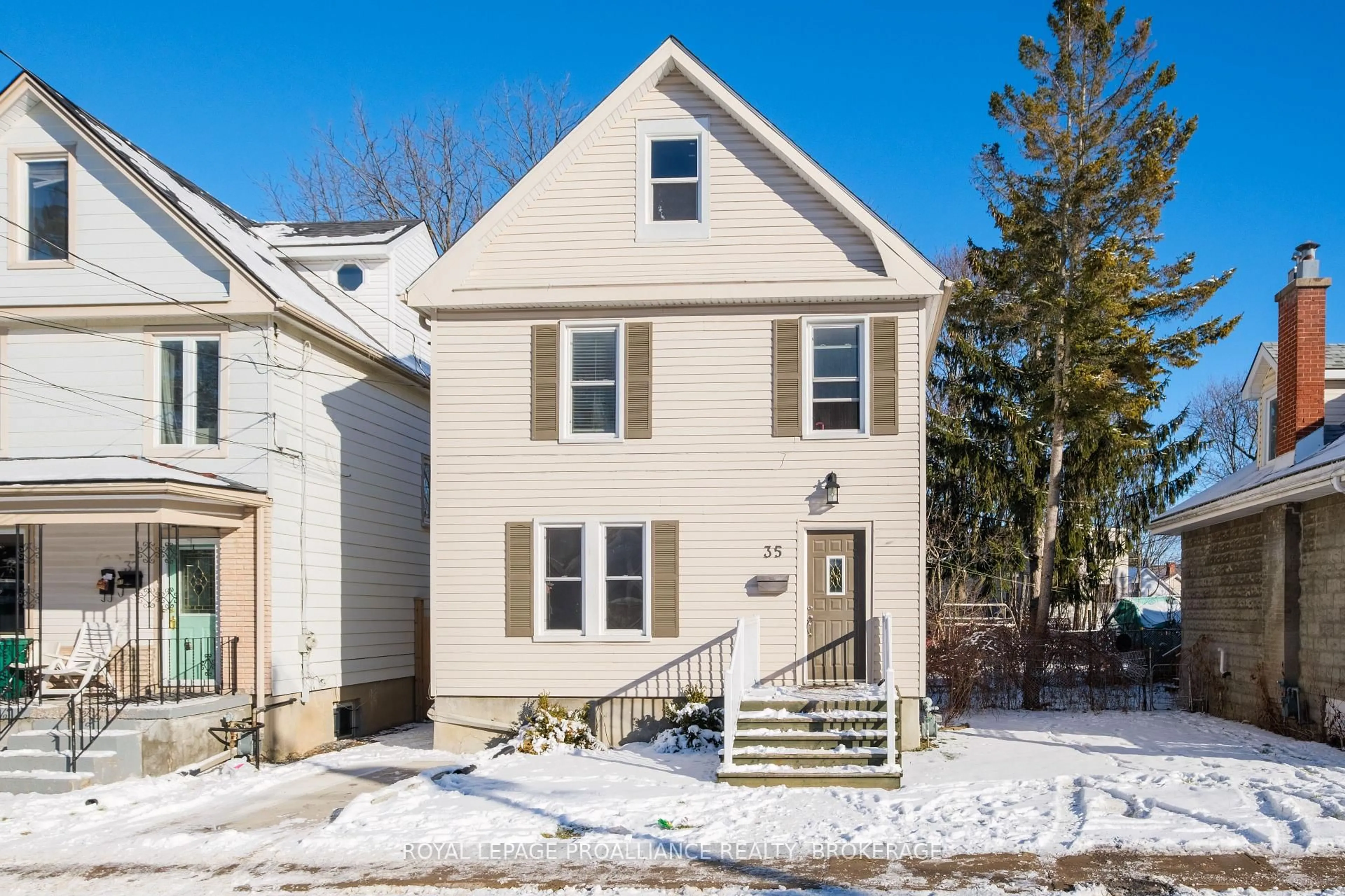 Home with vinyl exterior material, street for 35 Hamilton St, Kingston Ontario K7K 1P1