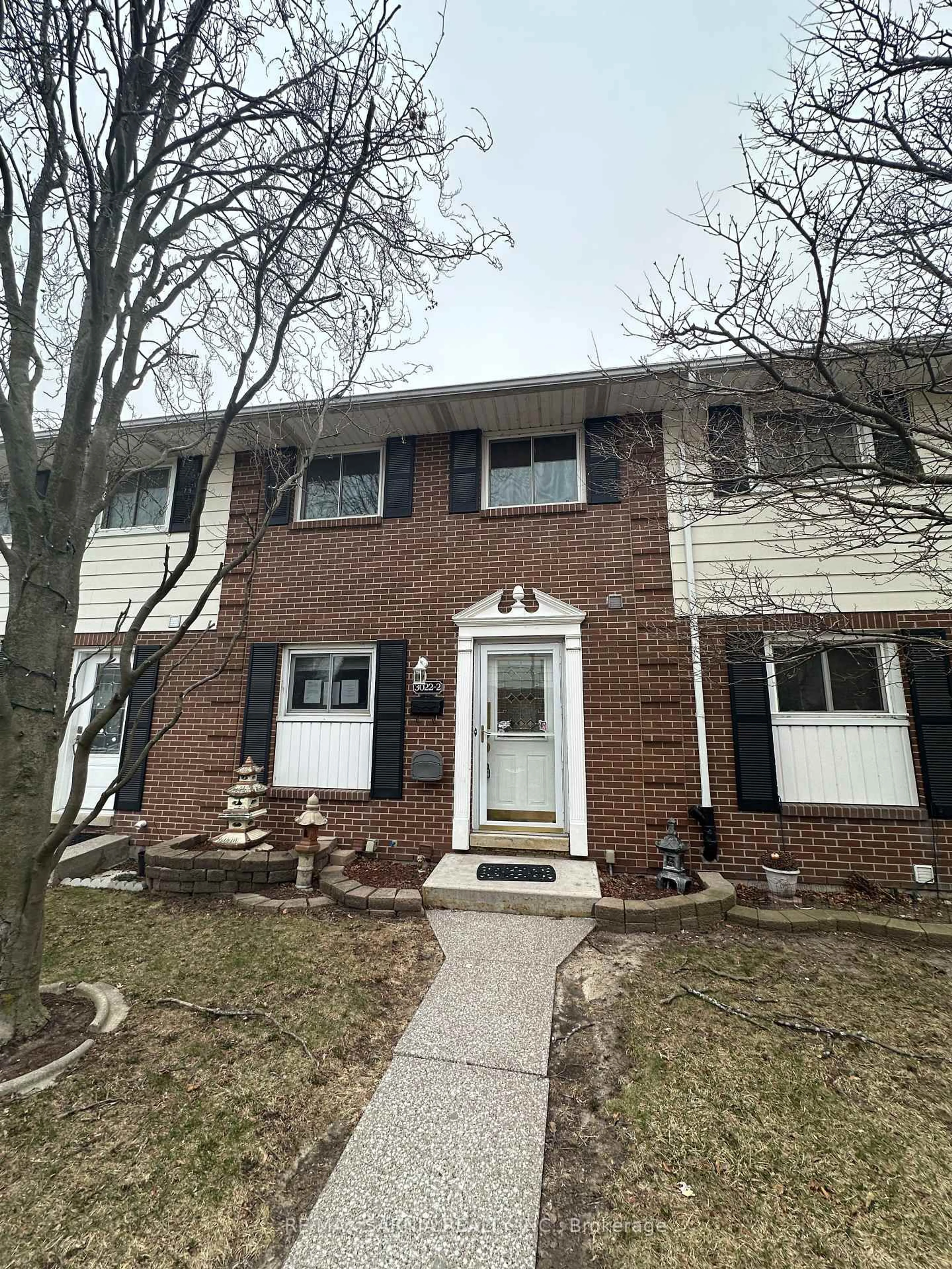 Home with brick exterior material, street for 3022 Meadowbrook Lane #2, Windsor Ontario N8T 3G8