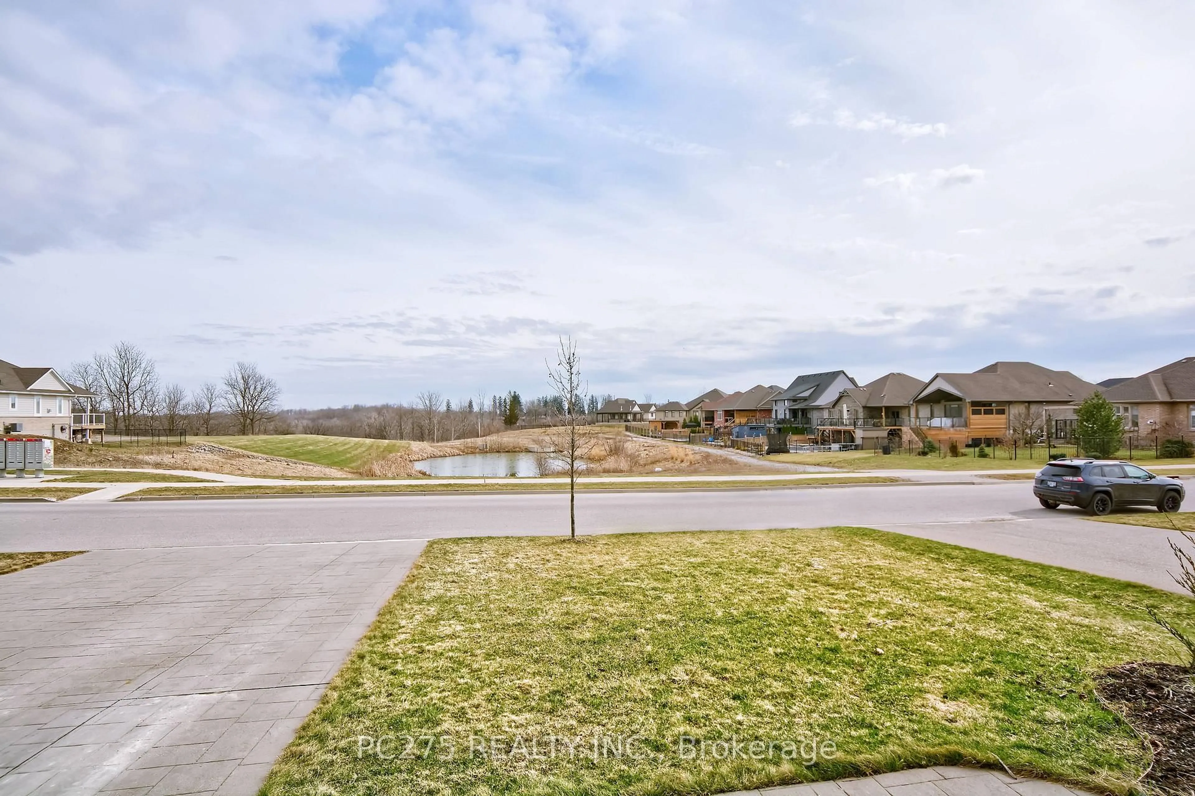 A pic from outside/outdoor area/front of a property/back of a property/a pic from drone, water/lake/river/ocean view for 22 Talbot Grove Lane, Southwold Ontario N5P 3T2