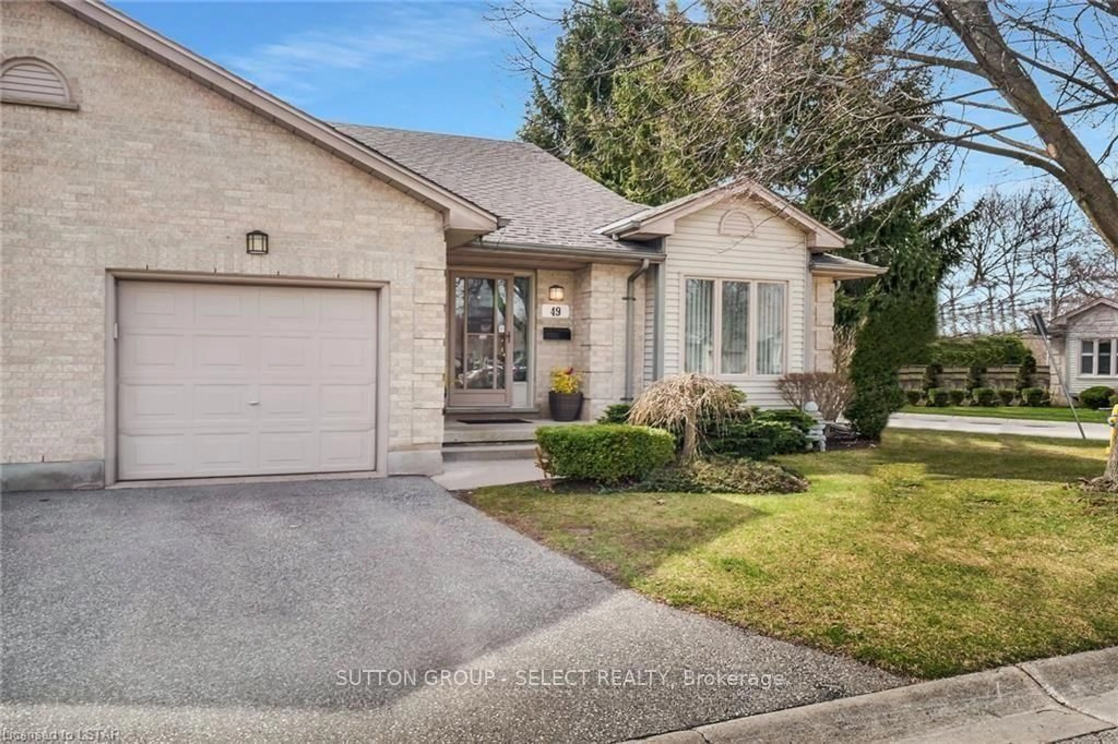 Home with brick exterior material, street for 99 Edgevalley Rd #49, London East Ontario N5Y 5N1