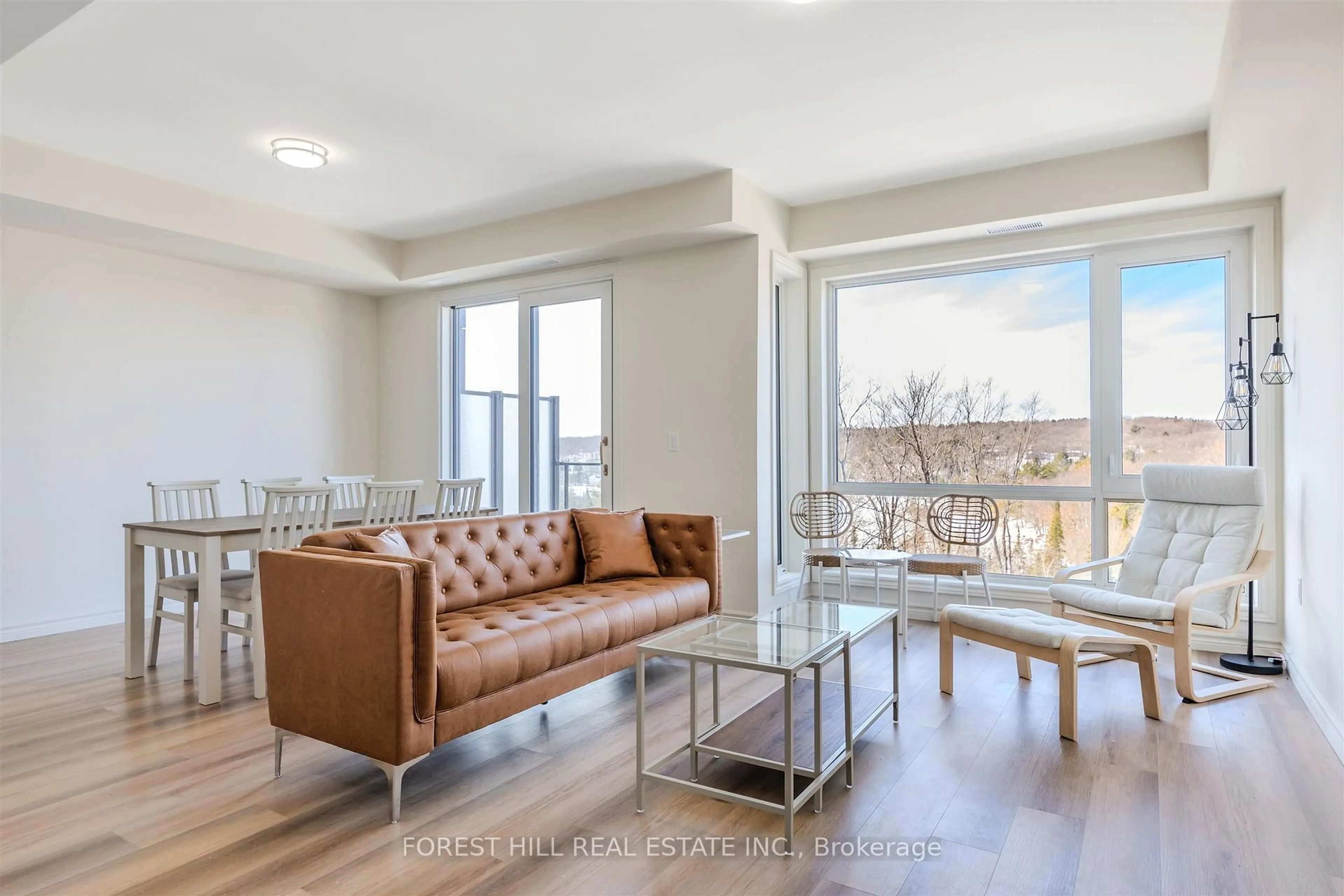 Living room with furniture, wood/laminate floor for 119 Town Line Rd #F109, Huntsville Ontario P1H 1S7