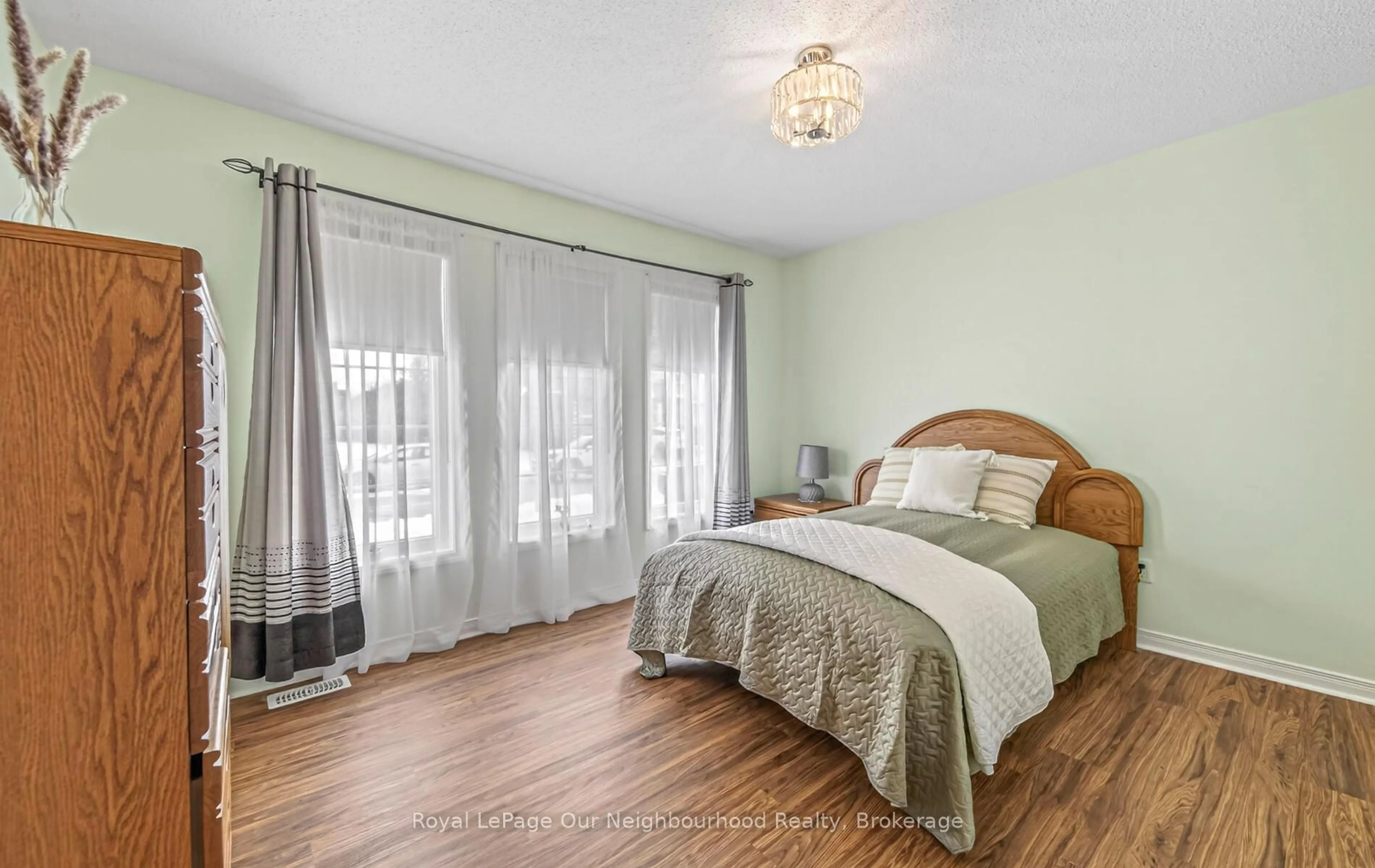 Bedroom with bed, wood/laminate floor for 713 Henderson Dr, Cobourg Ontario K9A 0J3