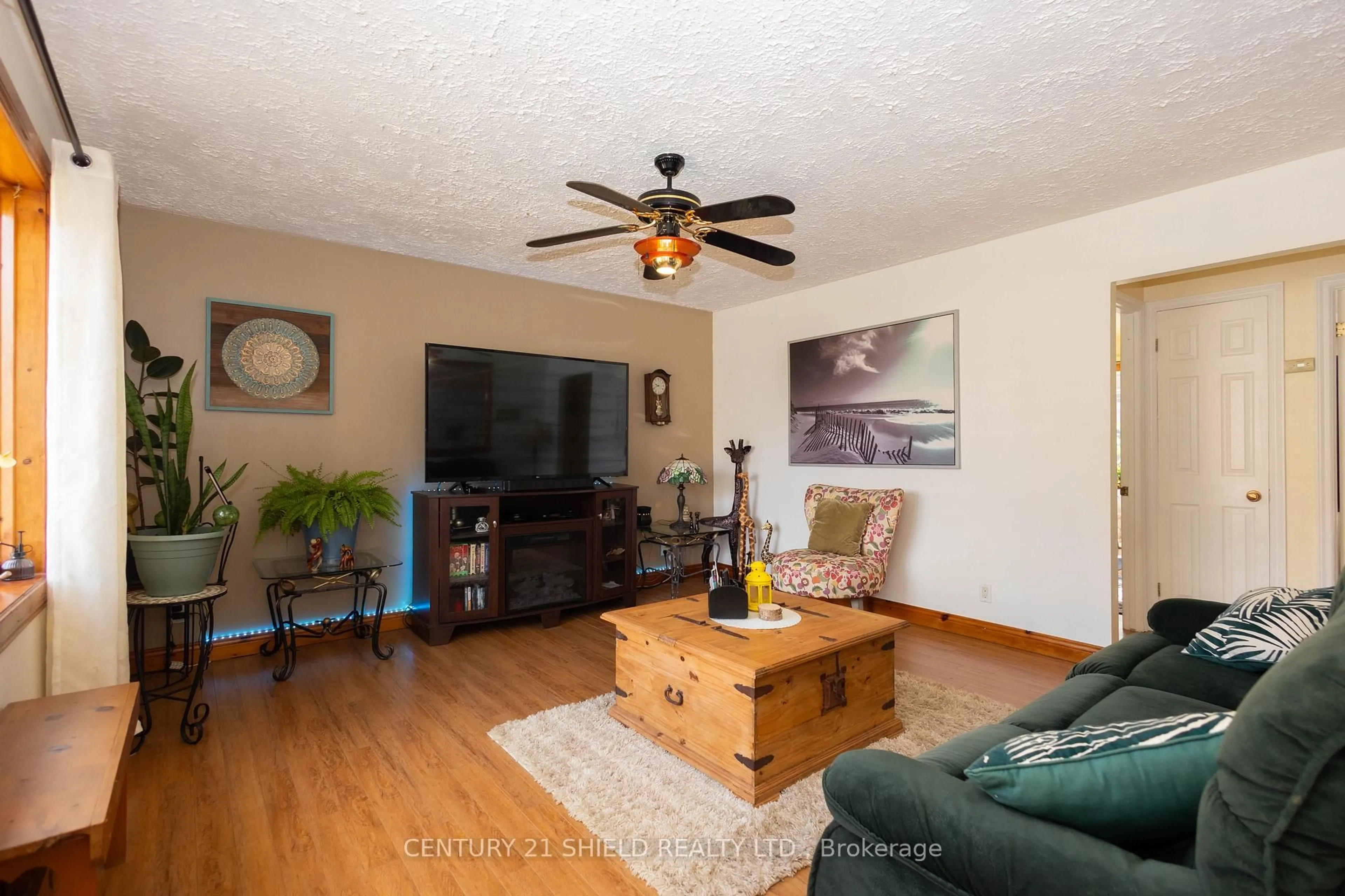 Living room with furniture, wood/laminate floor for 1443 1st St, Cornwall Ontario K6H 1P7