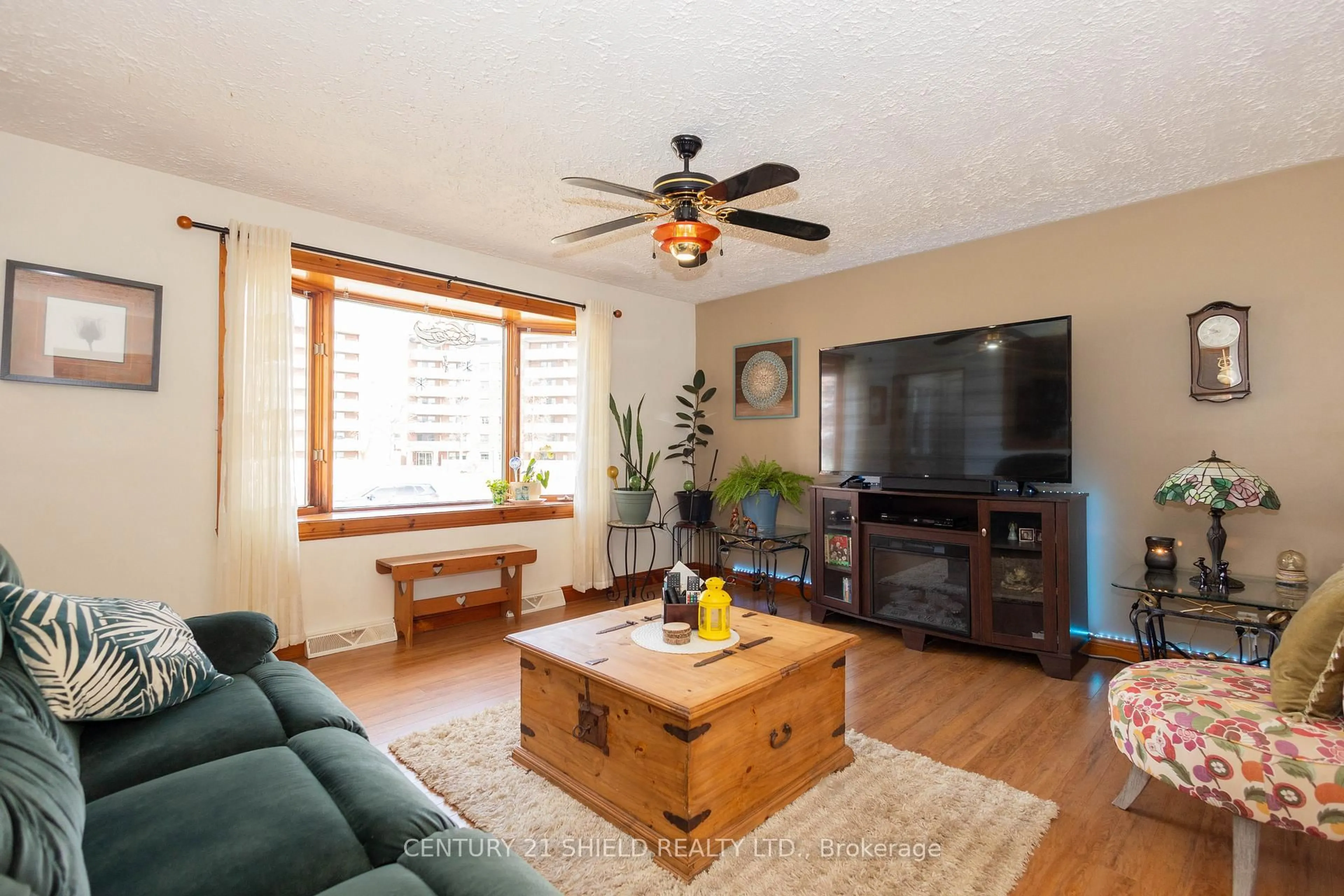 Living room with furniture, wood/laminate floor for 1443 1st St, Cornwall Ontario K6H 1P7