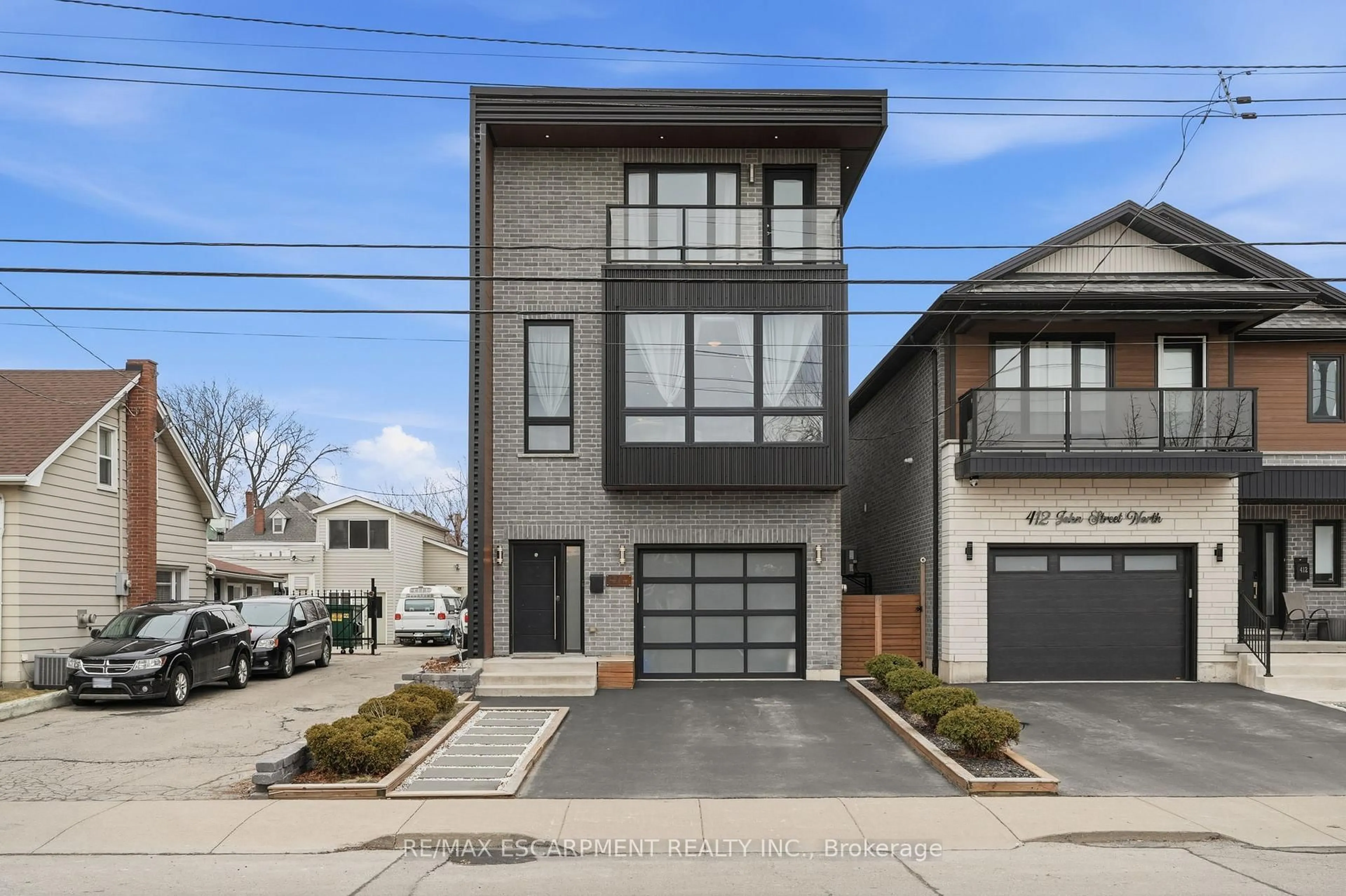 Home with brick exterior material, street for 414 JOHN St, Hamilton Ontario L8L 4R3