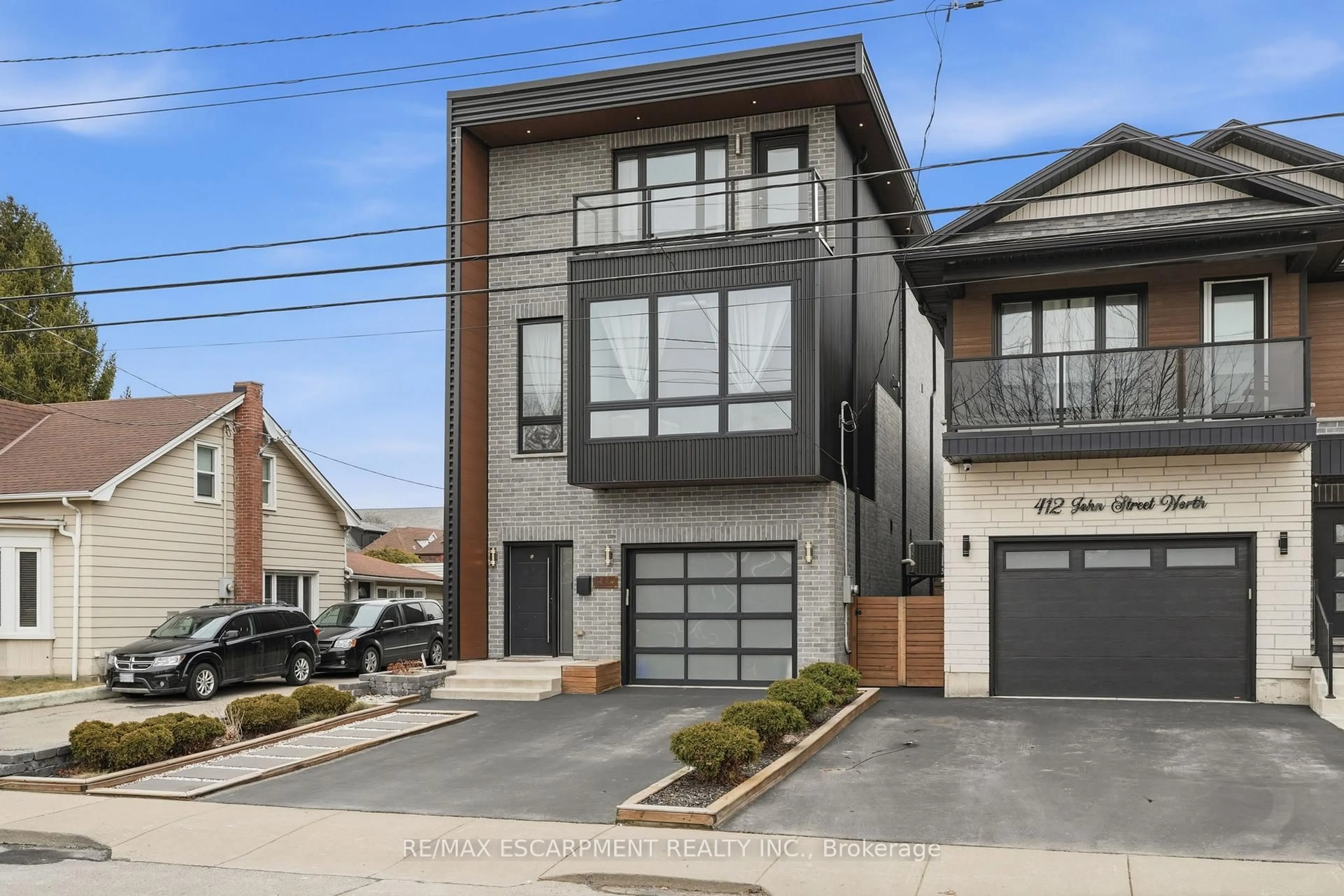 Home with brick exterior material, street for 414 JOHN St, Hamilton Ontario L8L 4R3