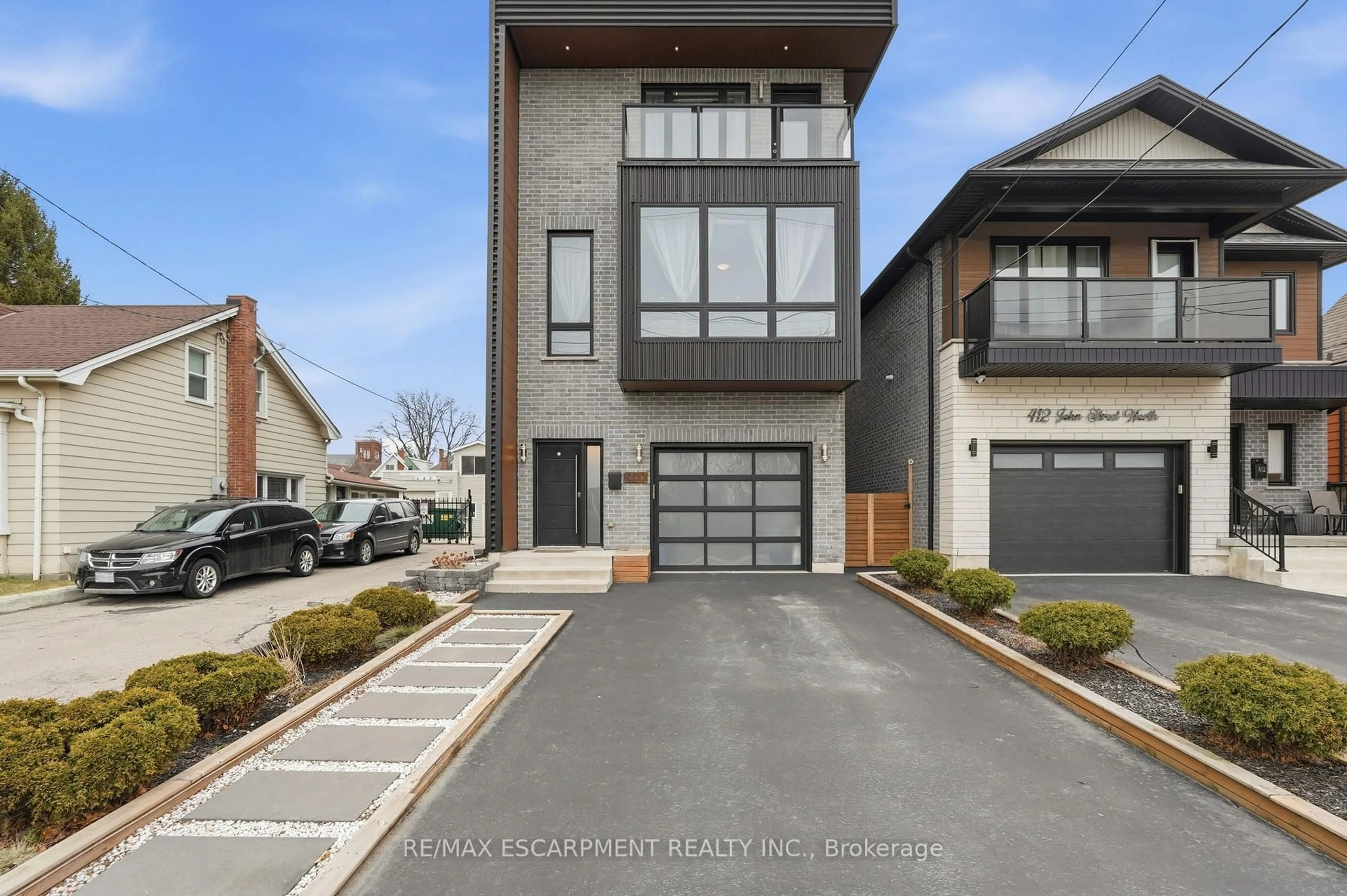 Home with brick exterior material, street for 414 JOHN St, Hamilton Ontario L8L 4R3