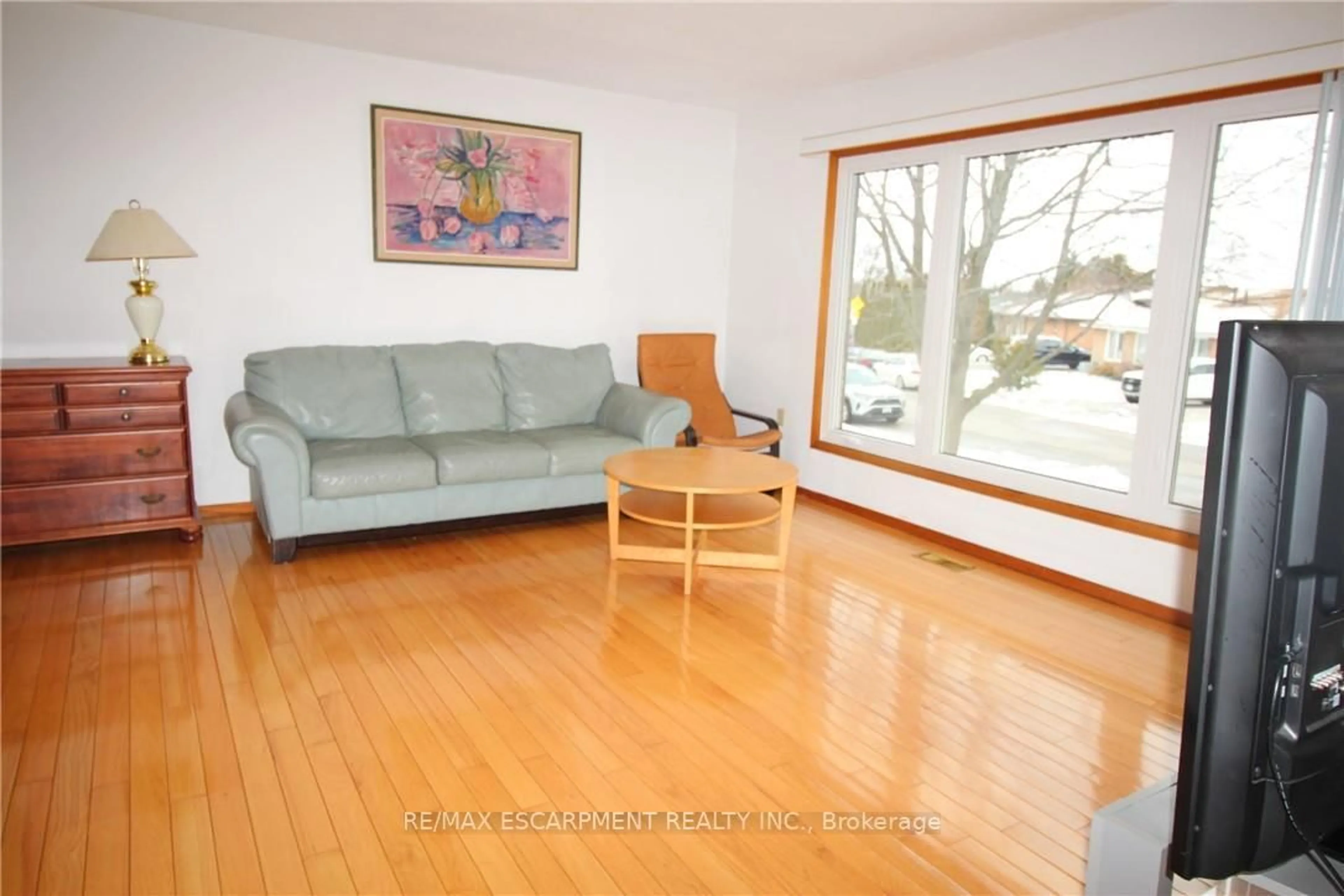 Living room with furniture, wood/laminate floor for 234 Greencedar Dr, Hamilton Ontario L9C 6W6