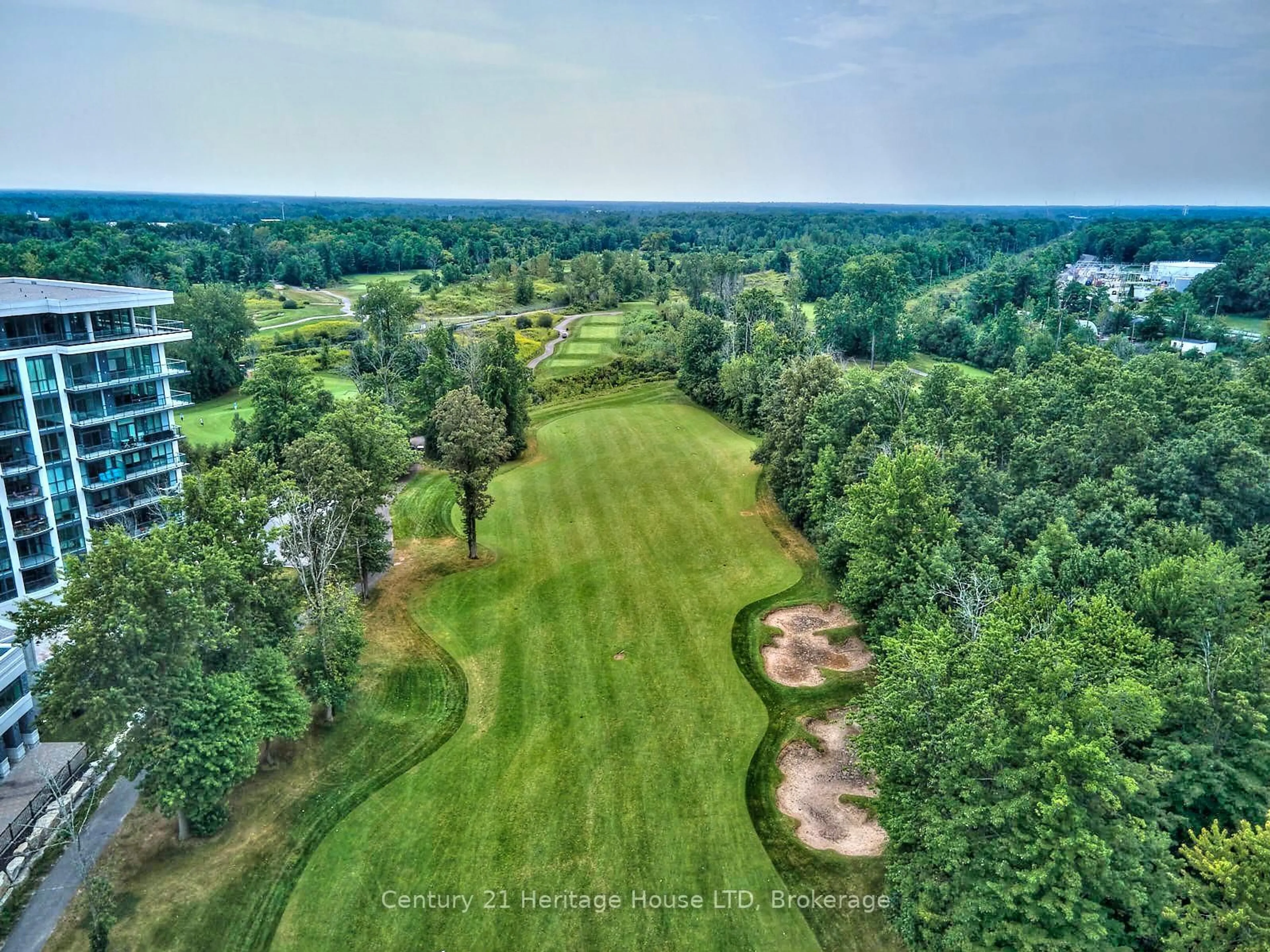 A pic from outside/outdoor area/front of a property/back of a property/a pic from drone, forest/trees view for 7711 Green Vista Gate #303, Niagara Falls Ontario L2H 1R1