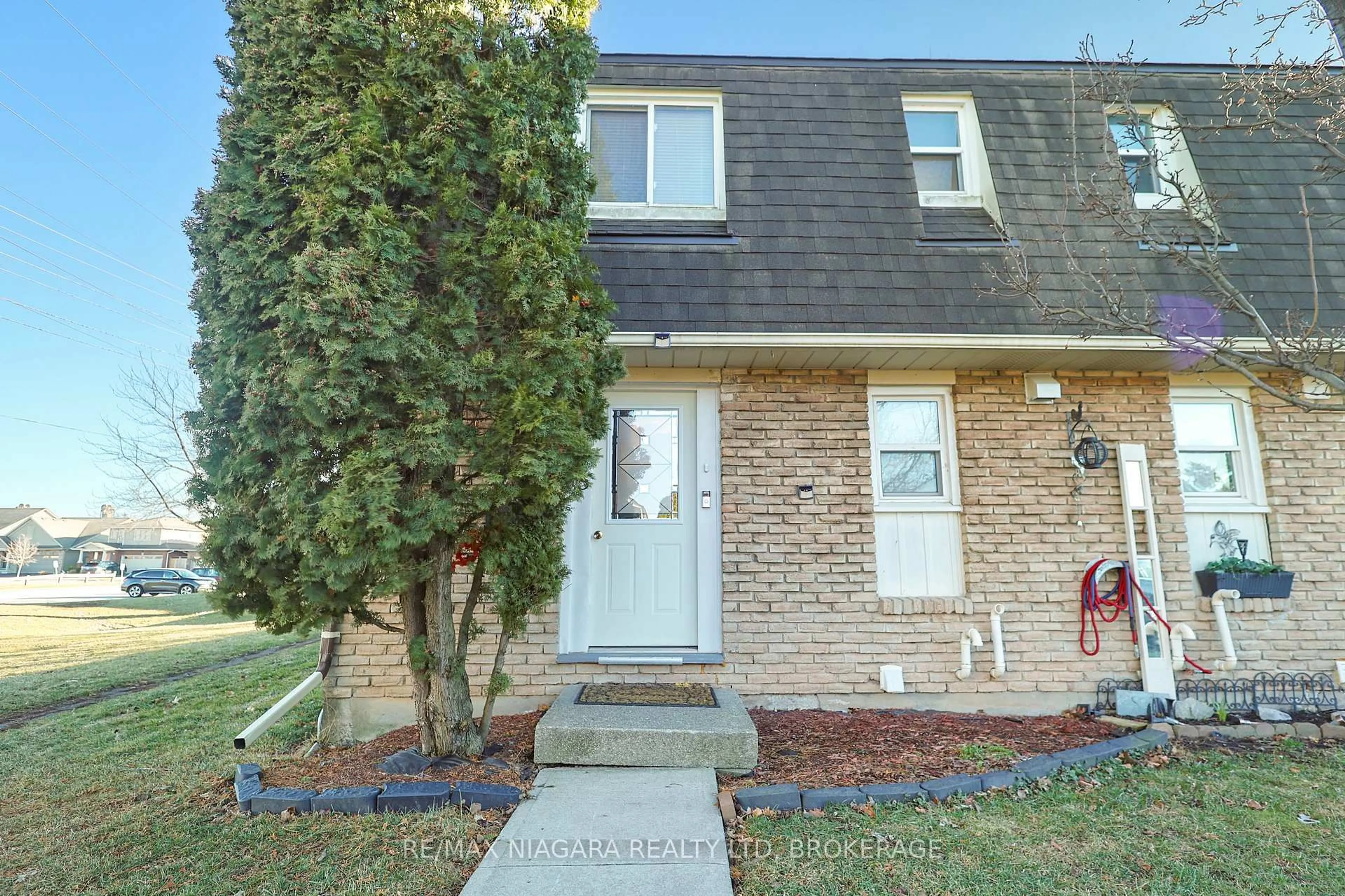 Home with brick exterior material, street for 131 Rockwood Ave #55, St. Catharines Ontario L2P 3K4