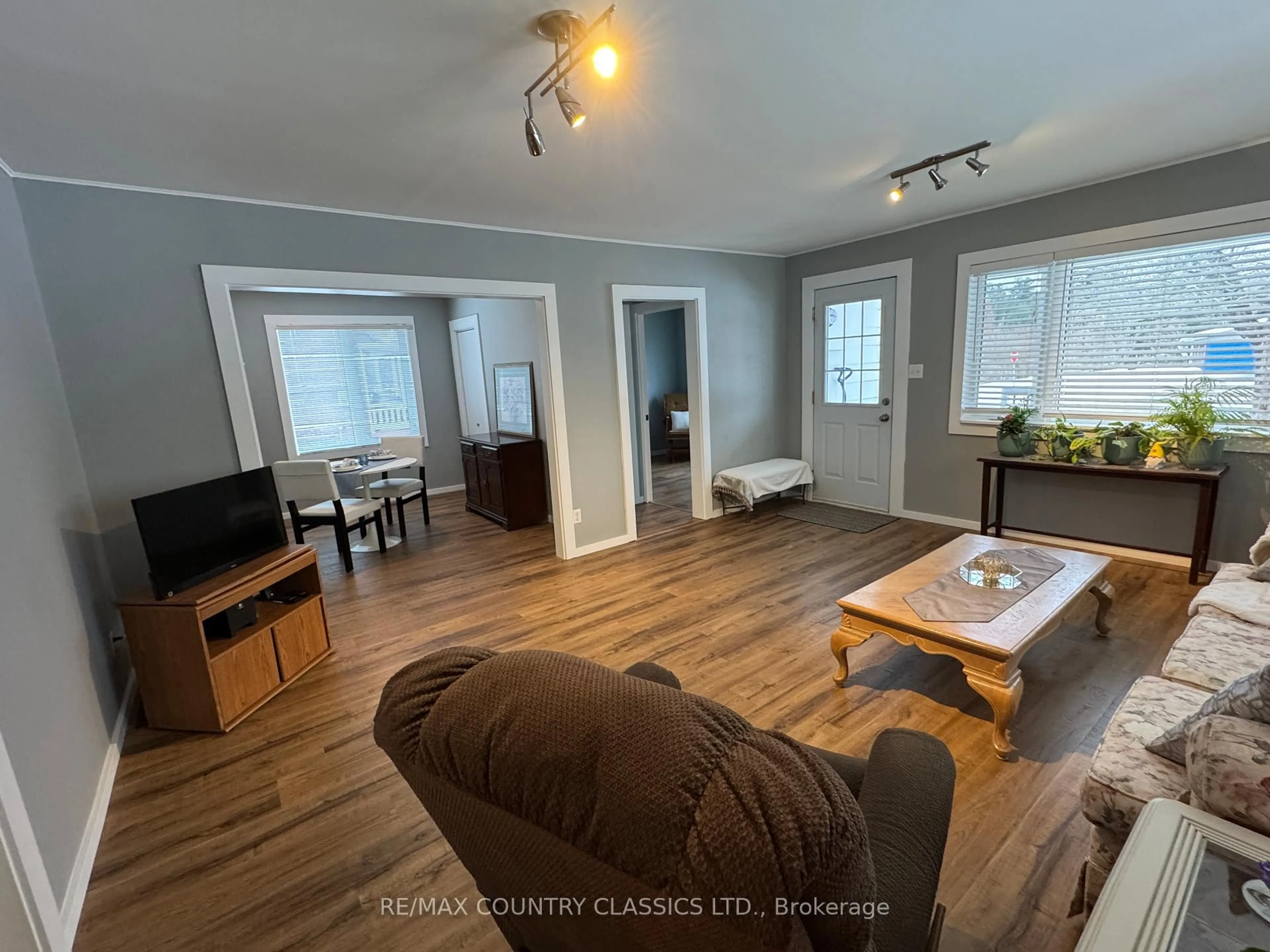 Living room with furniture, wood/laminate floor for 38 Flint Ave, Bancroft Ontario K0L 1C0