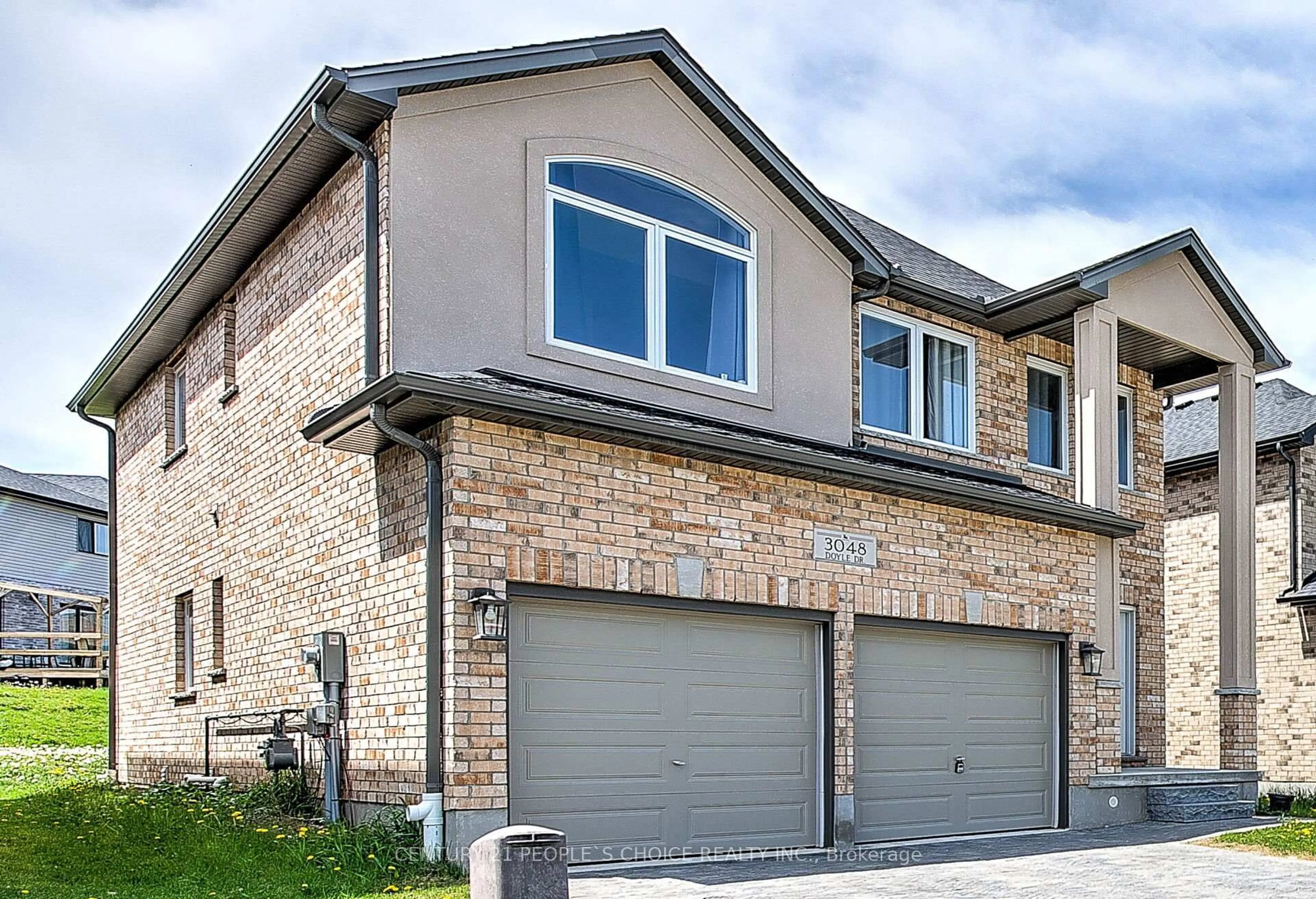 Home with brick exterior material, street for 3048 Doyle Dr, London South Ontario N6M 0G9