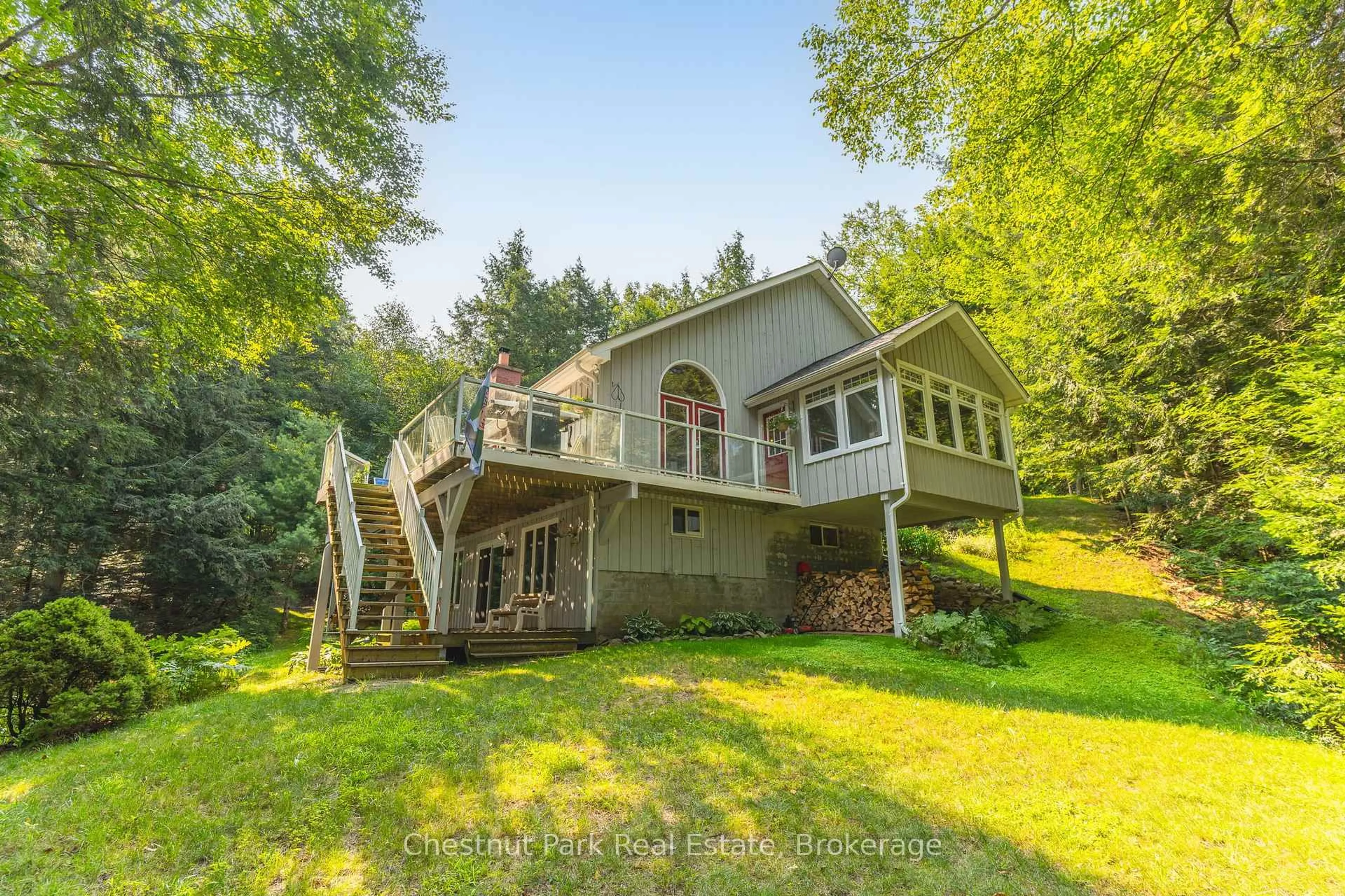 A pic from outside/outdoor area/front of a property/back of a property/a pic from drone, water/lake/river/ocean view for 1003 Arnott Lane, Dysart et al Ontario K0M 1S0