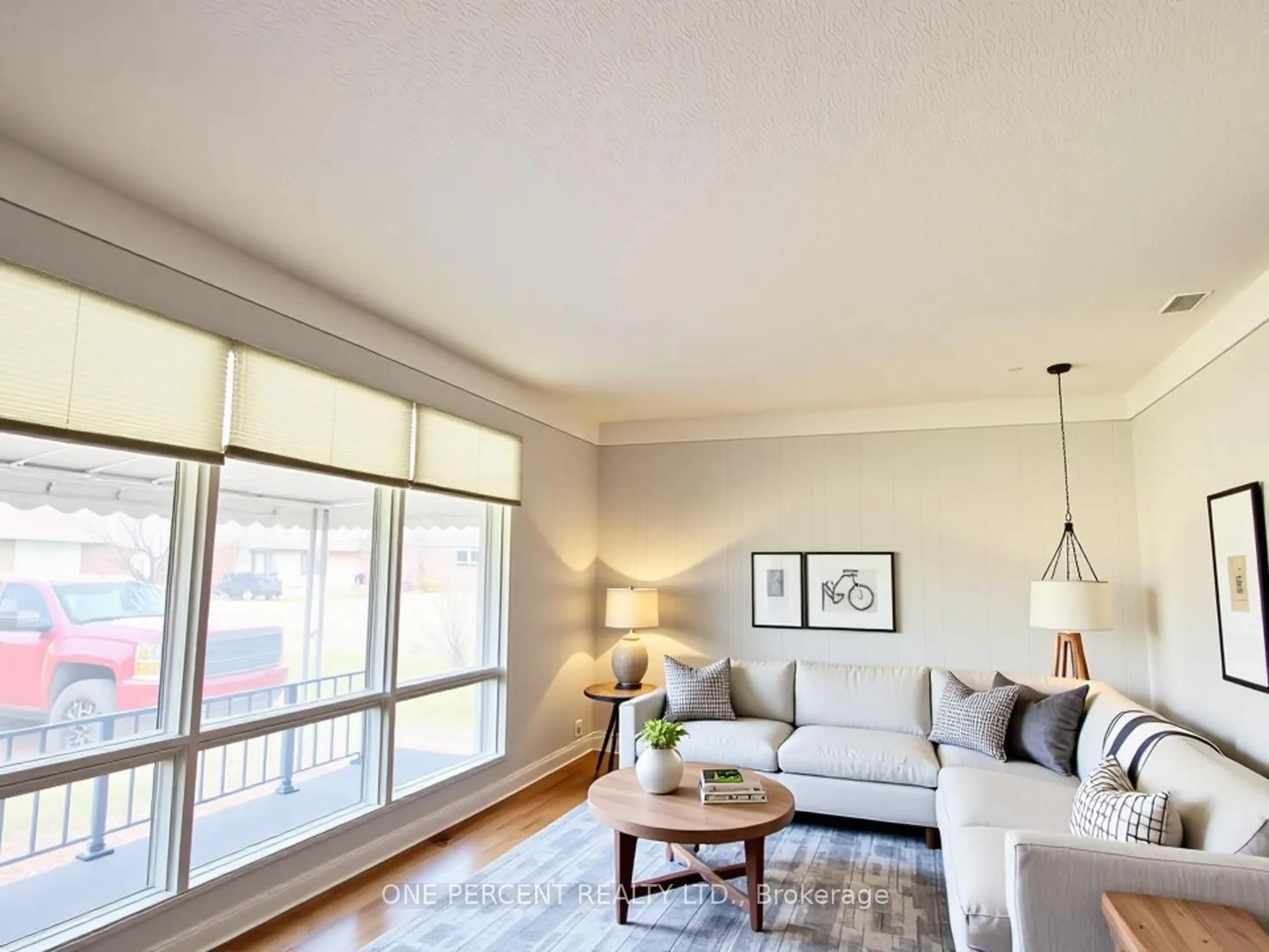 Living room with furniture, wood/laminate floor for 37 Empress Ave, Welland Ontario L3B 1K6