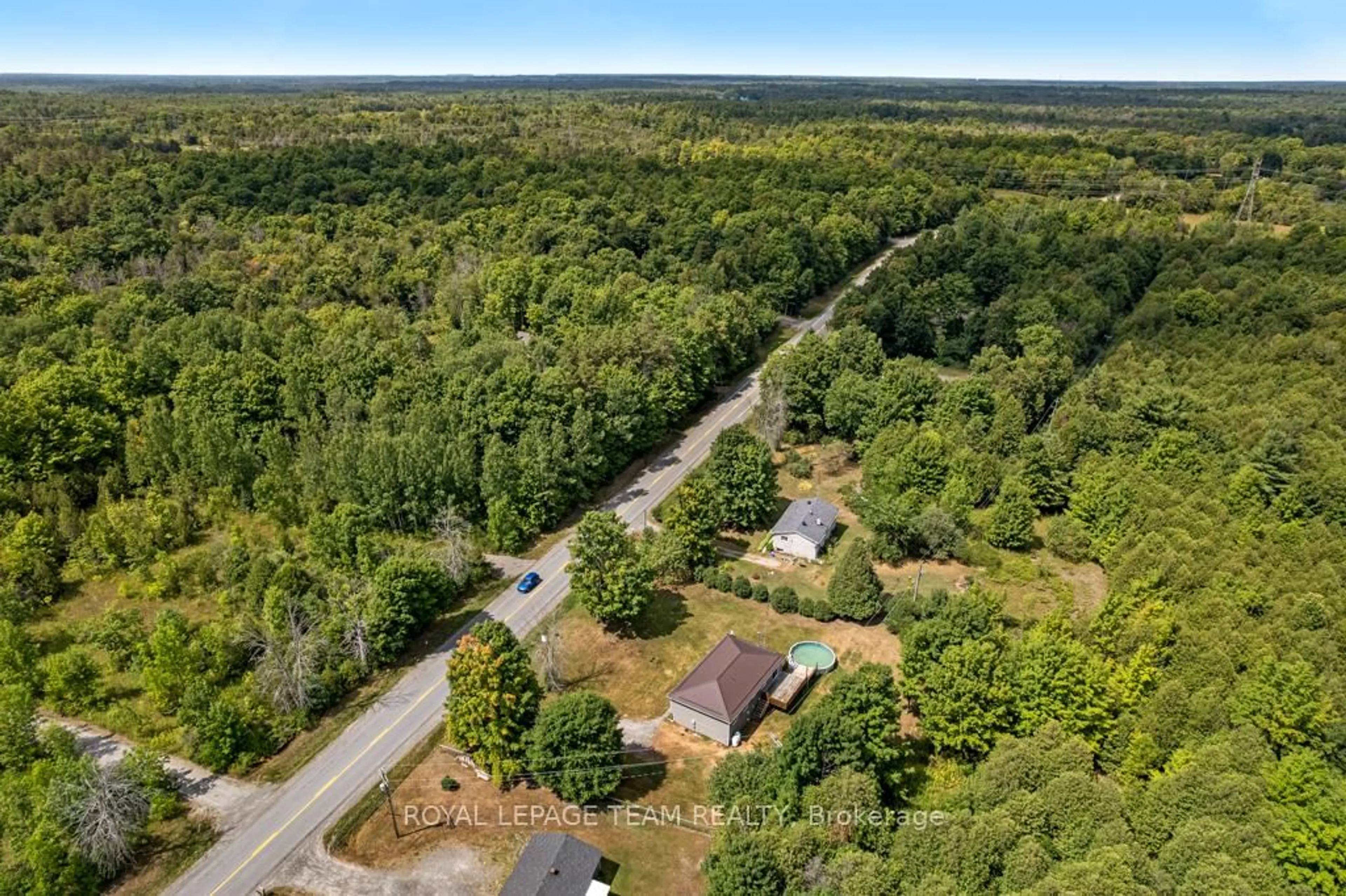 A pic from outside/outdoor area/front of a property/back of a property/a pic from drone, forest/trees view for 8133 County Rd 44 Rd, Edwardsburgh/Cardinal Ontario K0E 1X0