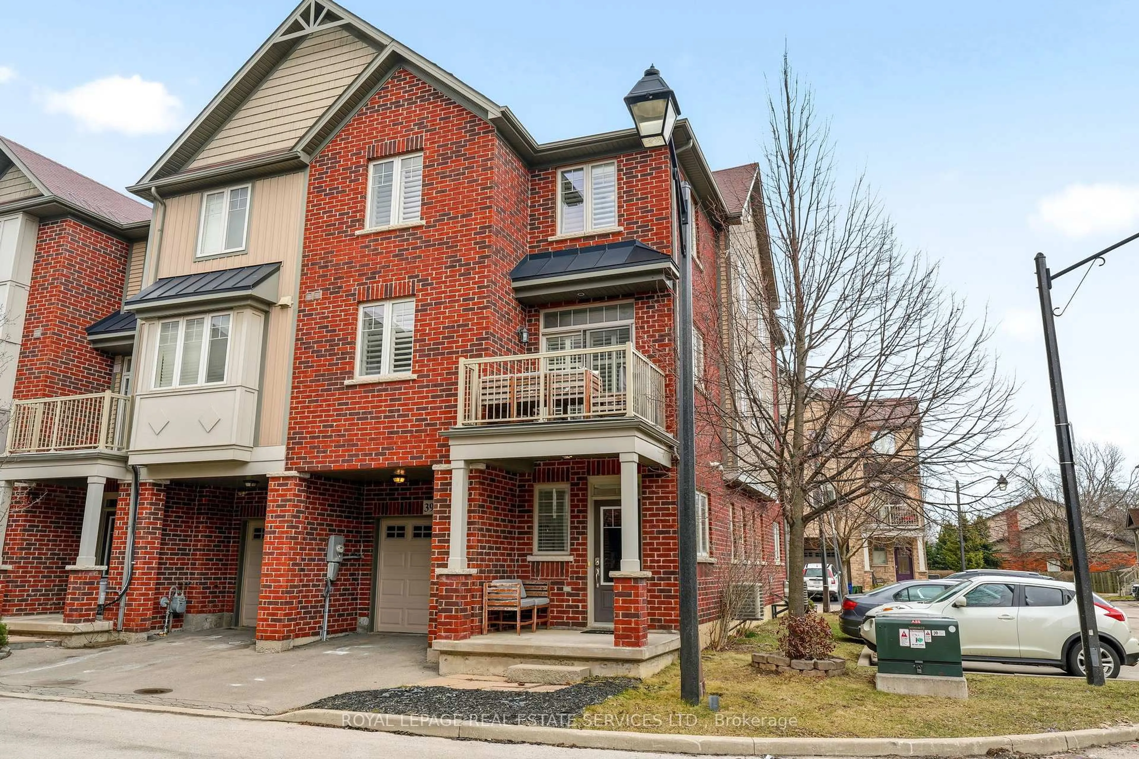 Home with brick exterior material, street for 310 Fall Fair Way #39, Hamilton Ontario L0R 1C0