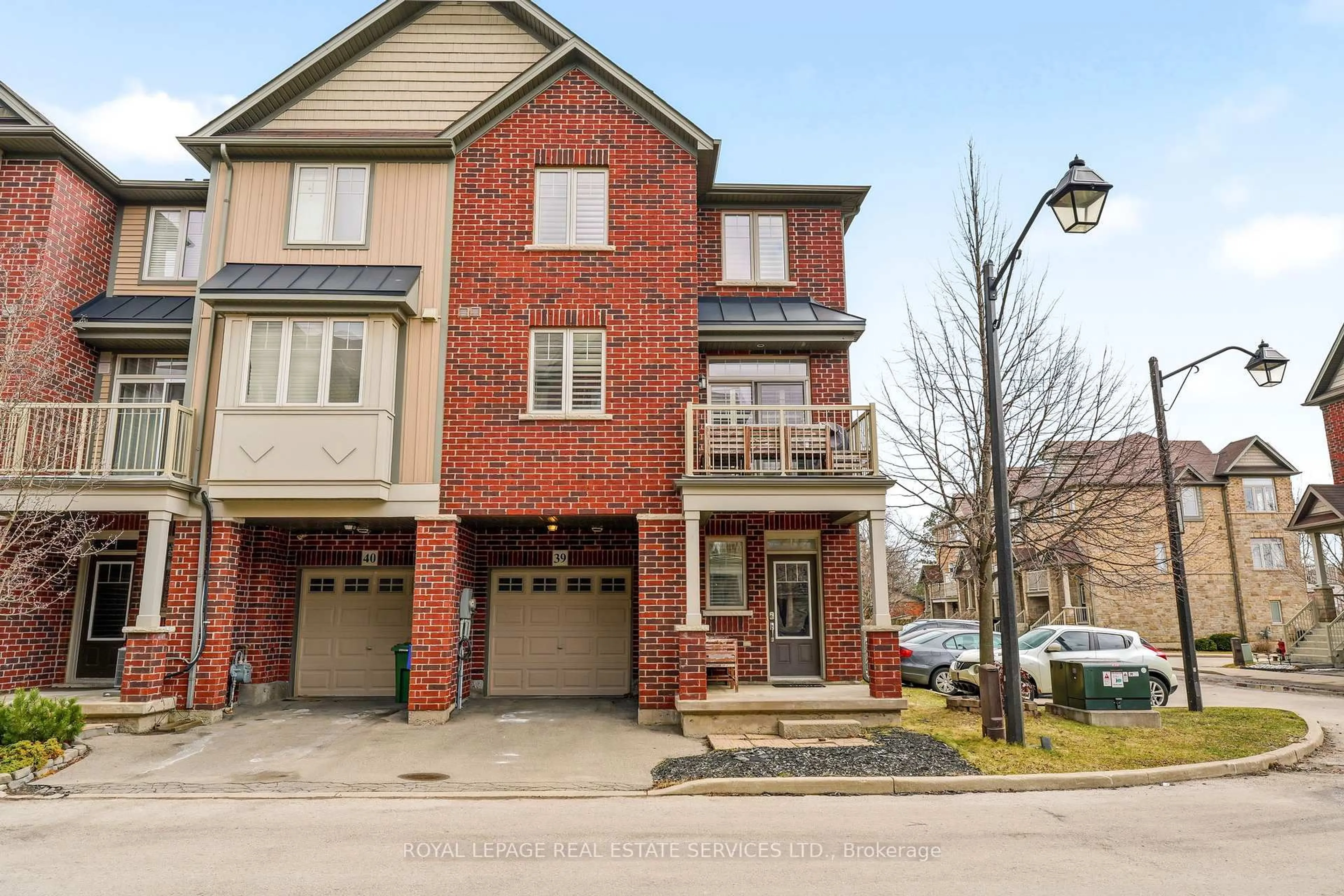 Home with brick exterior material, street for 310 Fall Fair Way #39, Hamilton Ontario L0R 1C0
