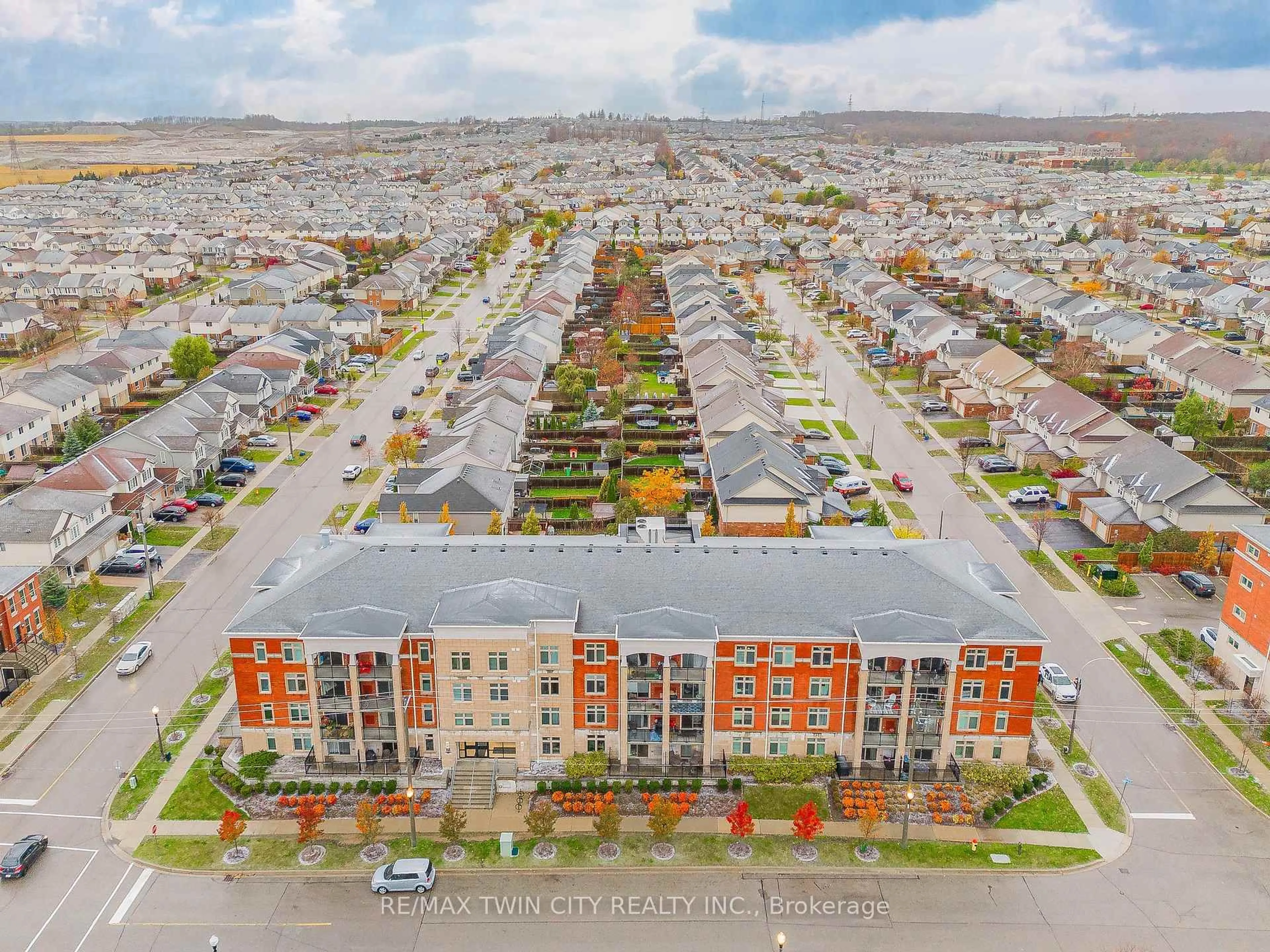 A pic from outside/outdoor area/front of a property/back of a property/a pic from drone, street for 155 Commonwealth St #410, Kitchener Ontario N2E 0G5