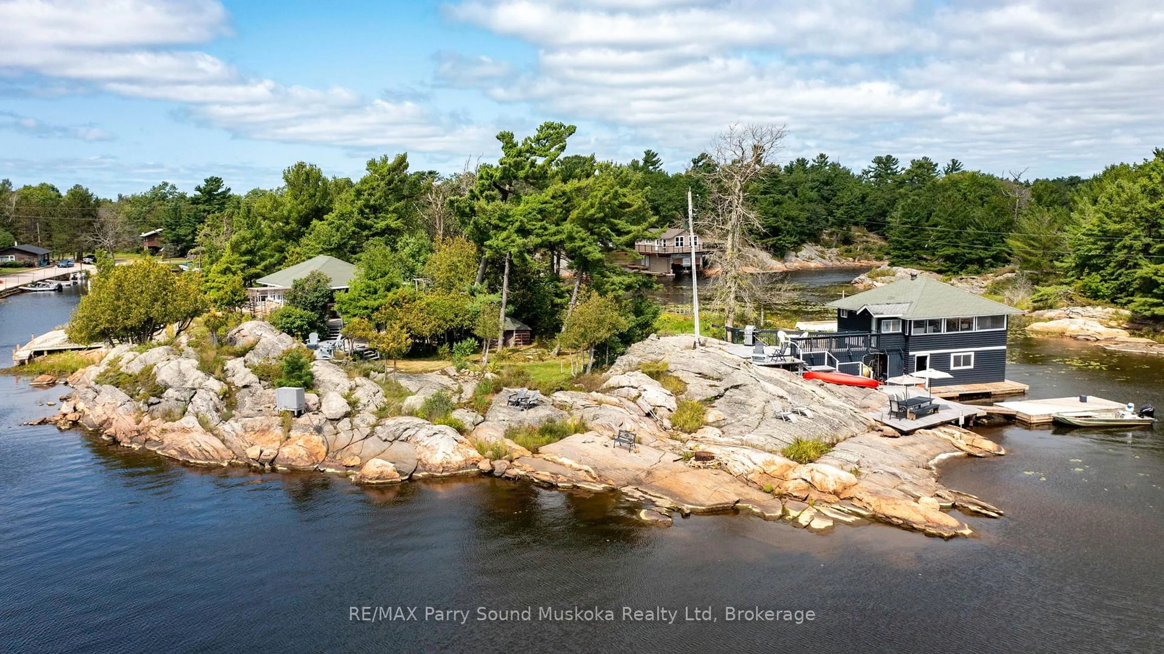 A pic from outside/outdoor area/front of a property/back of a property/a pic from drone, water/lake/river/ocean view for 1 Island 271c, Carling Ontario P0G 1G0
