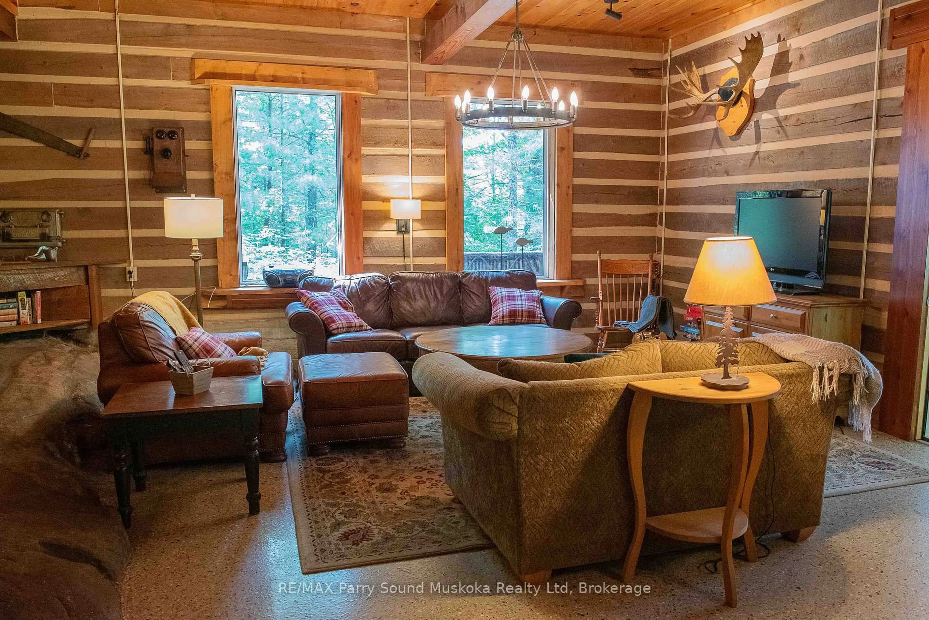 Living room with furniture, wood/laminate floor for 10 Harris Lake Water, Parry Sound Remote Area Ontario P0G 1K0