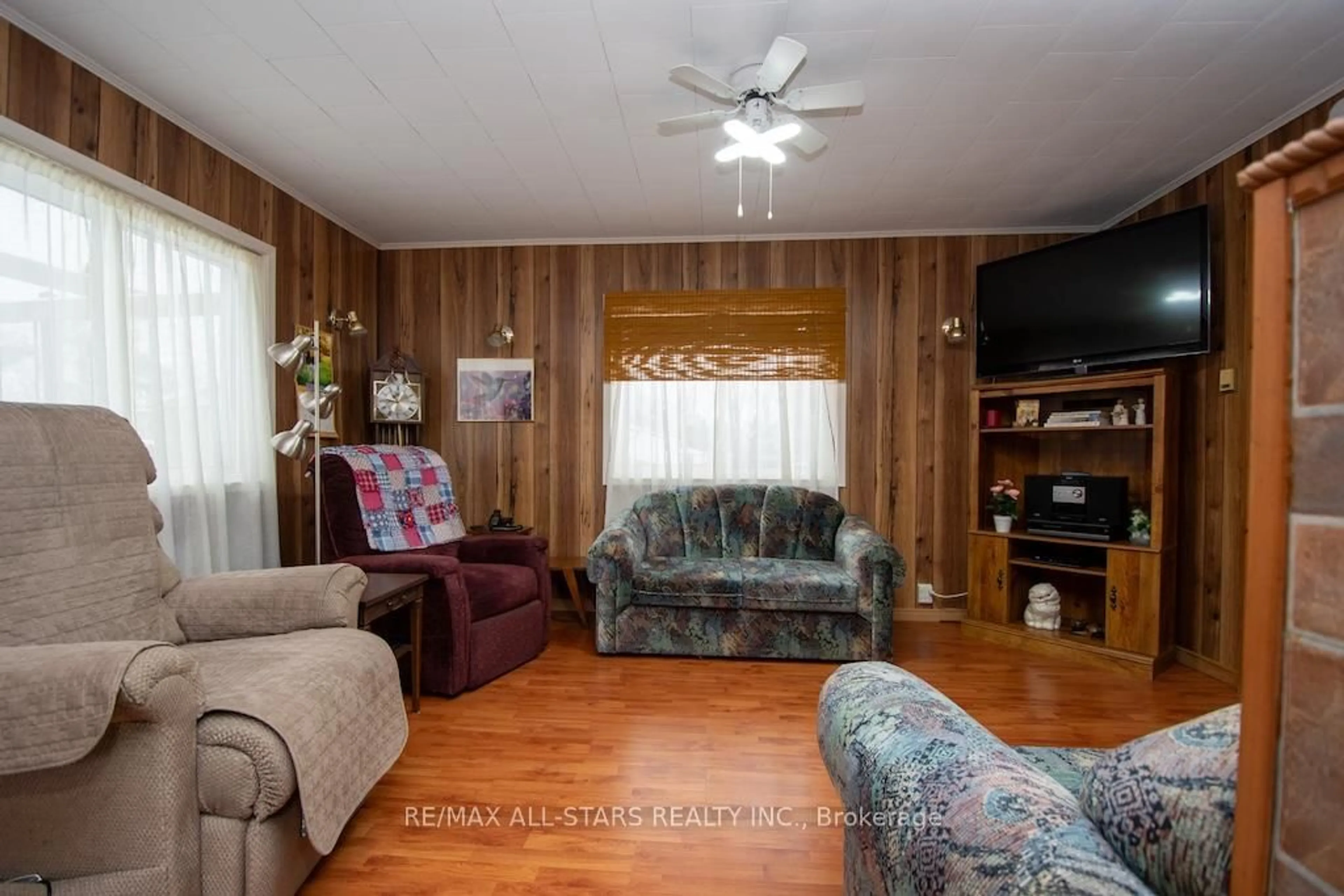 Living room with furniture, wood/laminate floor for 534 Fenel Rd, Kawartha Lakes Ontario K0M 2T0