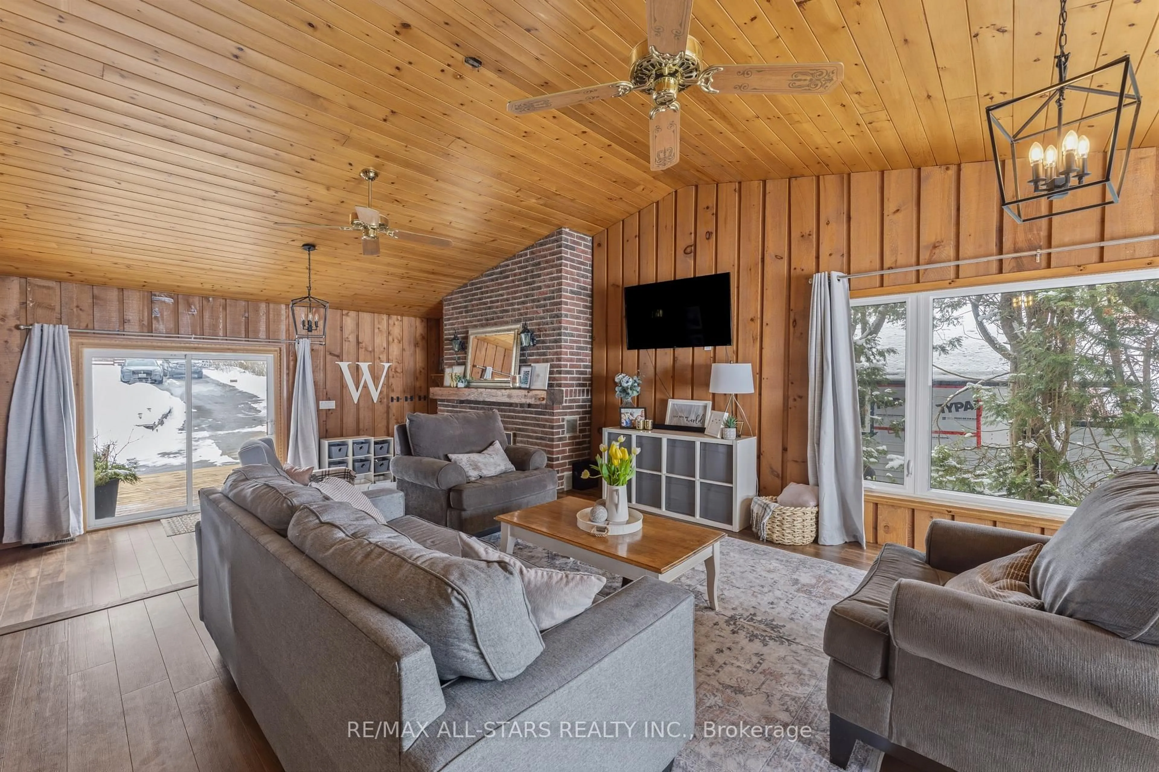 Living room with furniture, wood/laminate floor for 393 Hillside Dr, Kawartha Lakes Ontario K0M 1C0