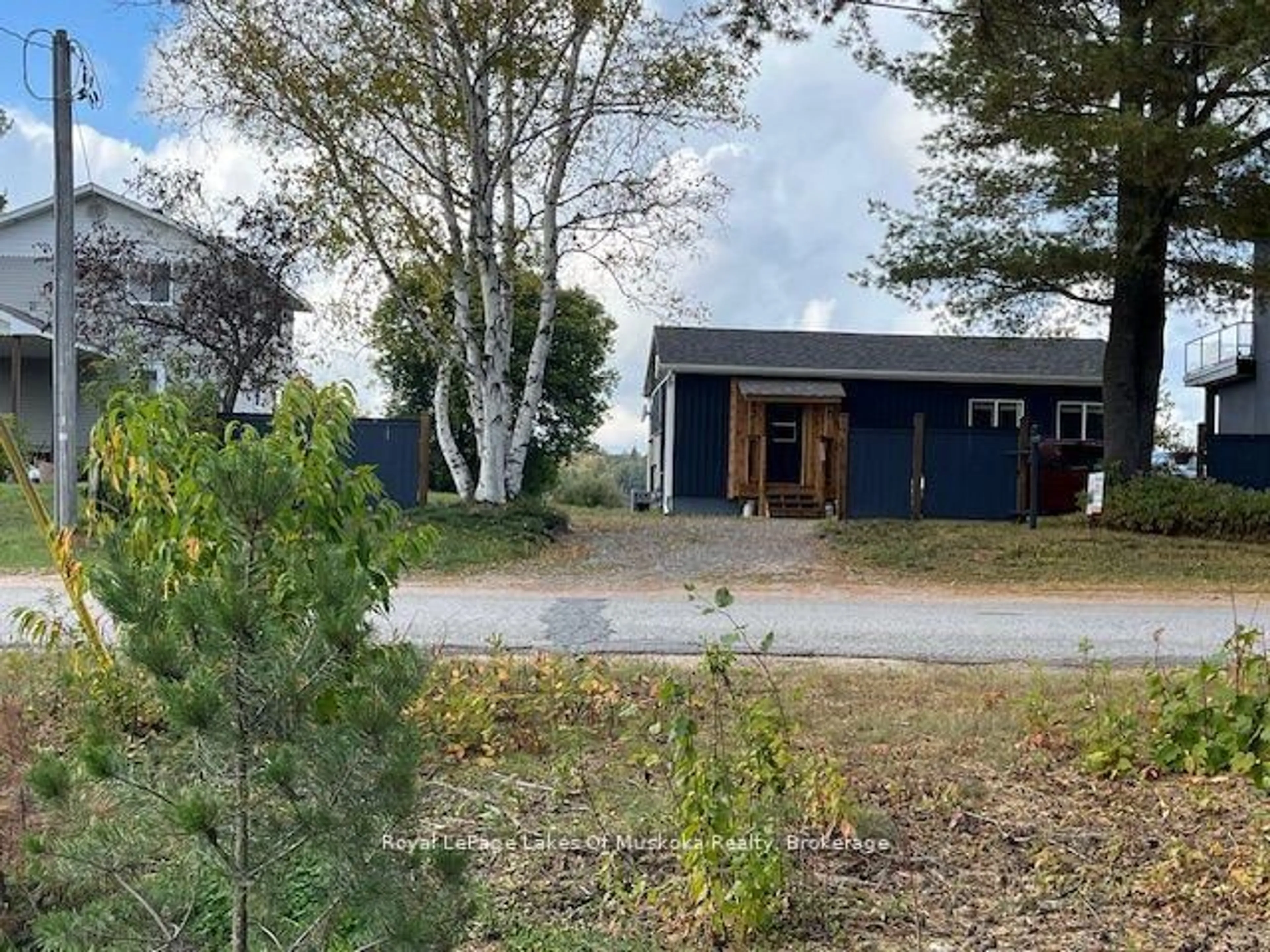 A pic from outside/outdoor area/front of a property/back of a property/a pic from drone, unknown for 36 Ottawa Ave, South River Ontario P0A 1X0