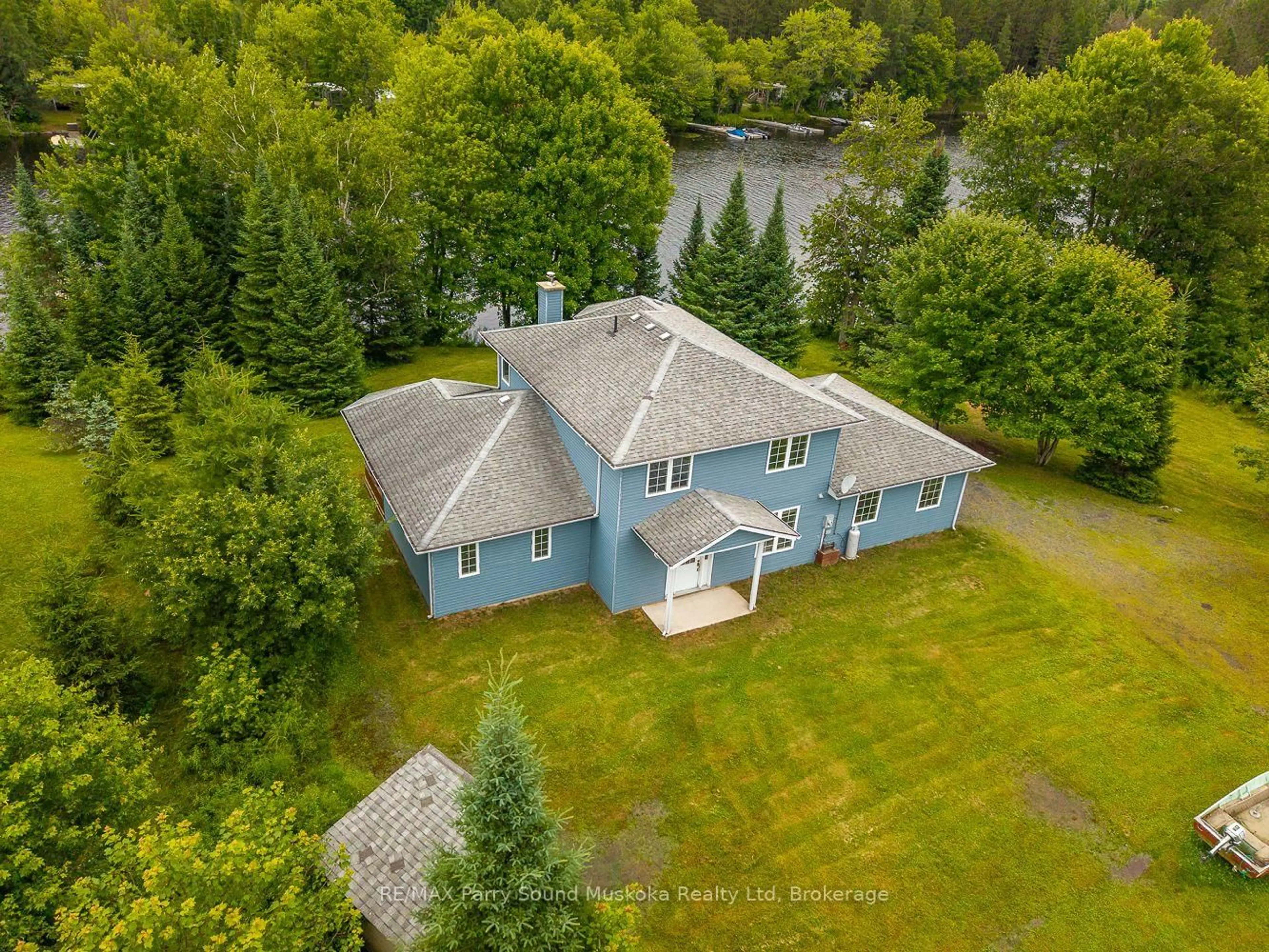 A pic from outside/outdoor area/front of a property/back of a property/a pic from drone, water/lake/river/ocean view for 25 Cole Point Tr, McKellar Ontario P2A 0B4