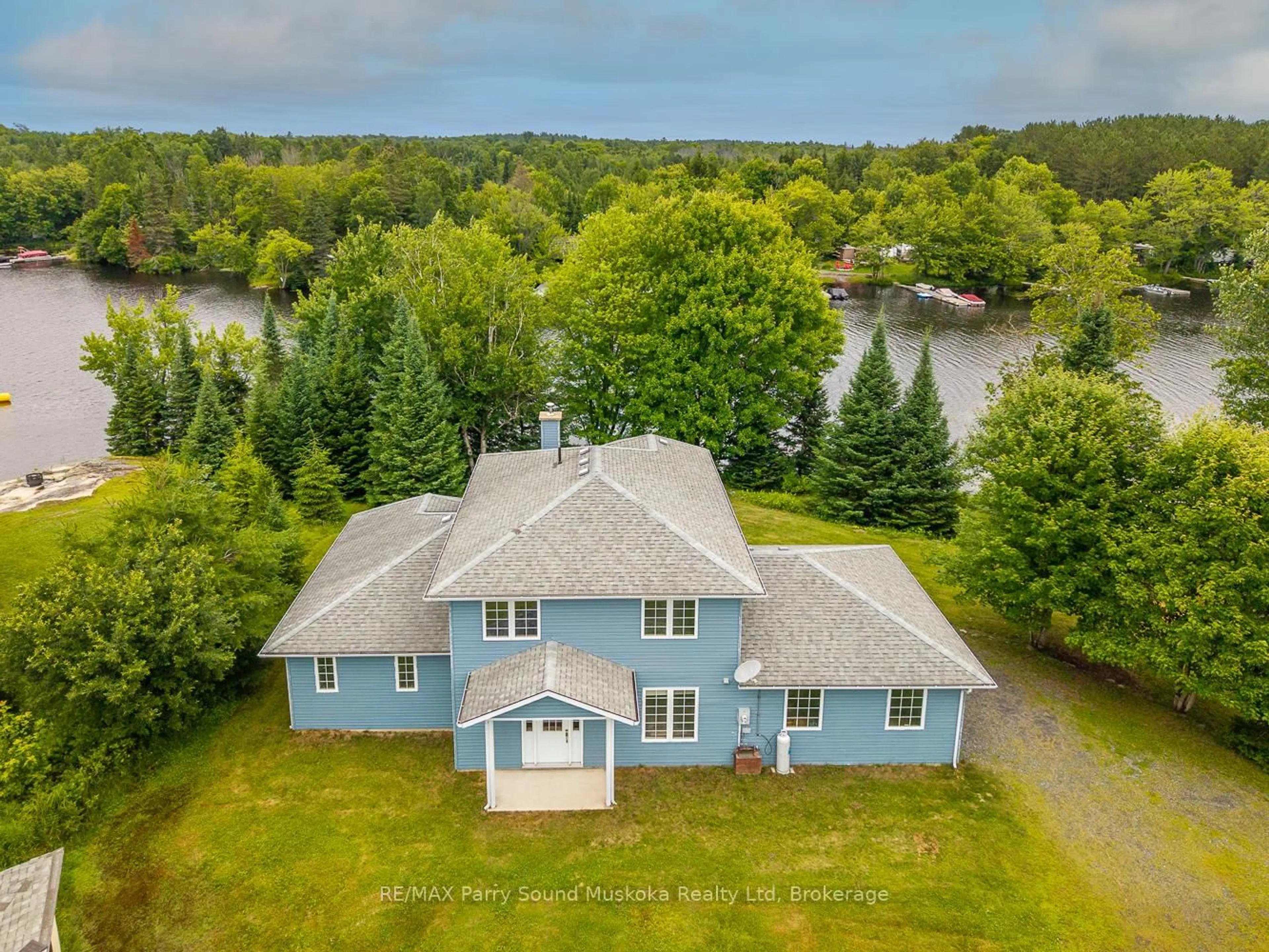 A pic from outside/outdoor area/front of a property/back of a property/a pic from drone, water/lake/river/ocean view for 25 Cole Point Tr, McKellar Ontario P2A 0B4