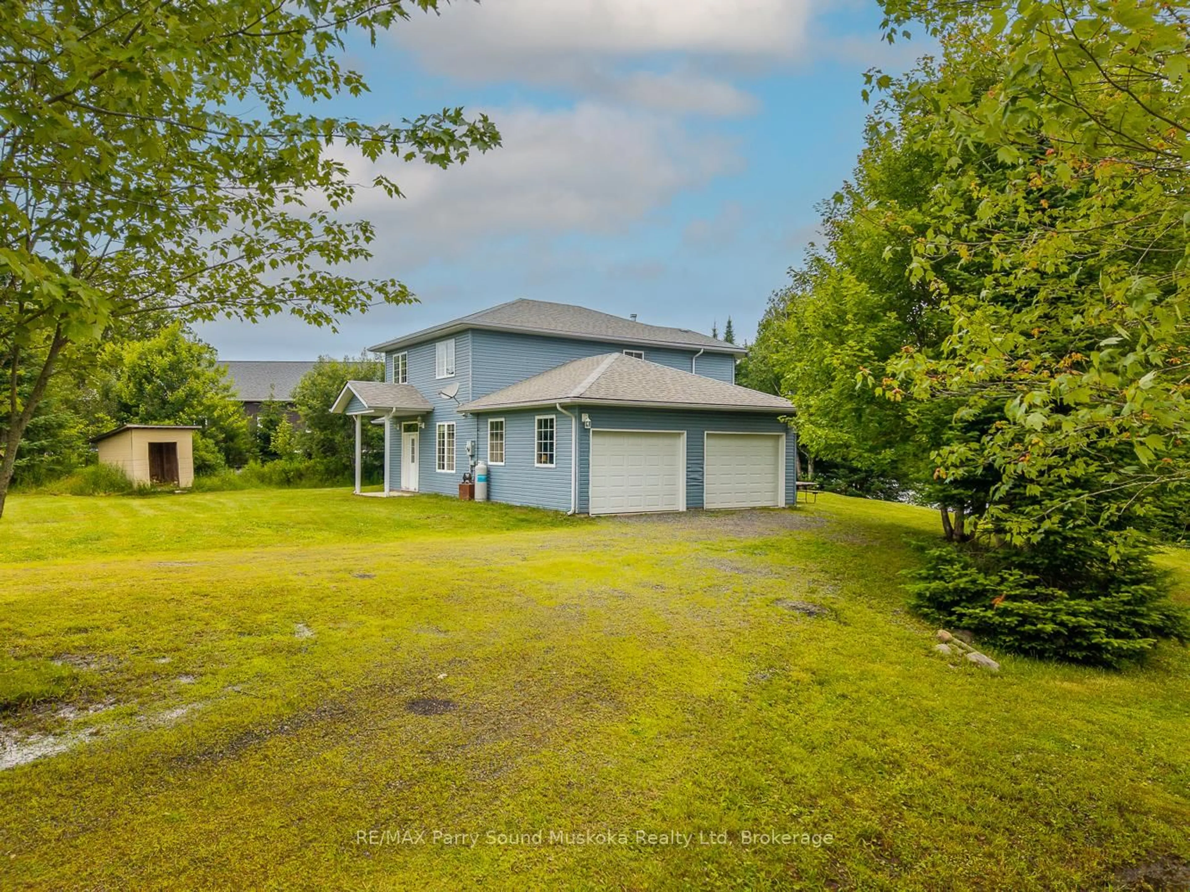 A pic from outside/outdoor area/front of a property/back of a property/a pic from drone, water/lake/river/ocean view for 25 Cole Point Tr, McKellar Ontario P2A 0B4