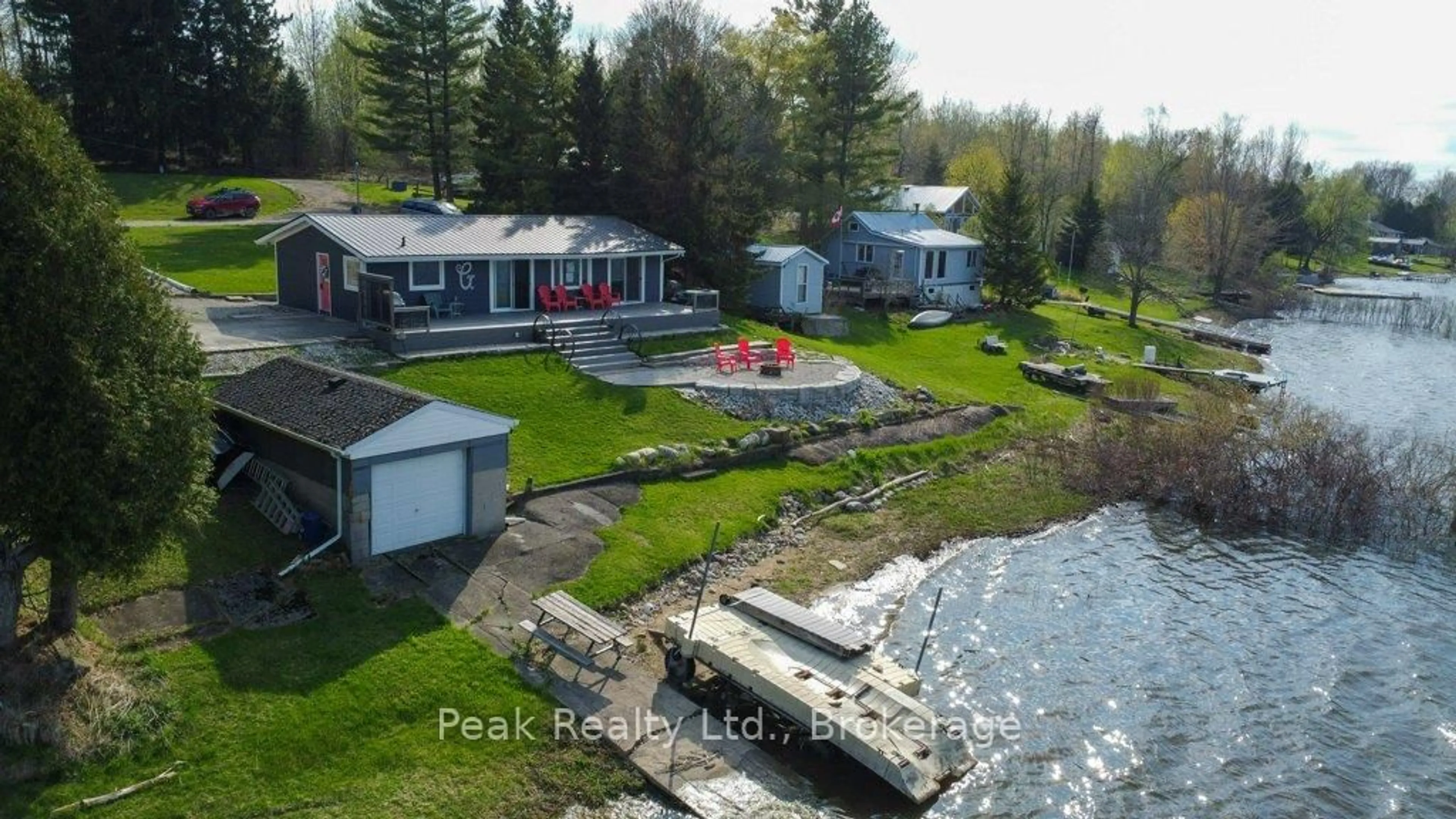 A pic from outside/outdoor area/front of a property/back of a property/a pic from drone, water/lake/river/ocean view for 137 Road 100, Mapleton Ontario N0G 1P0
