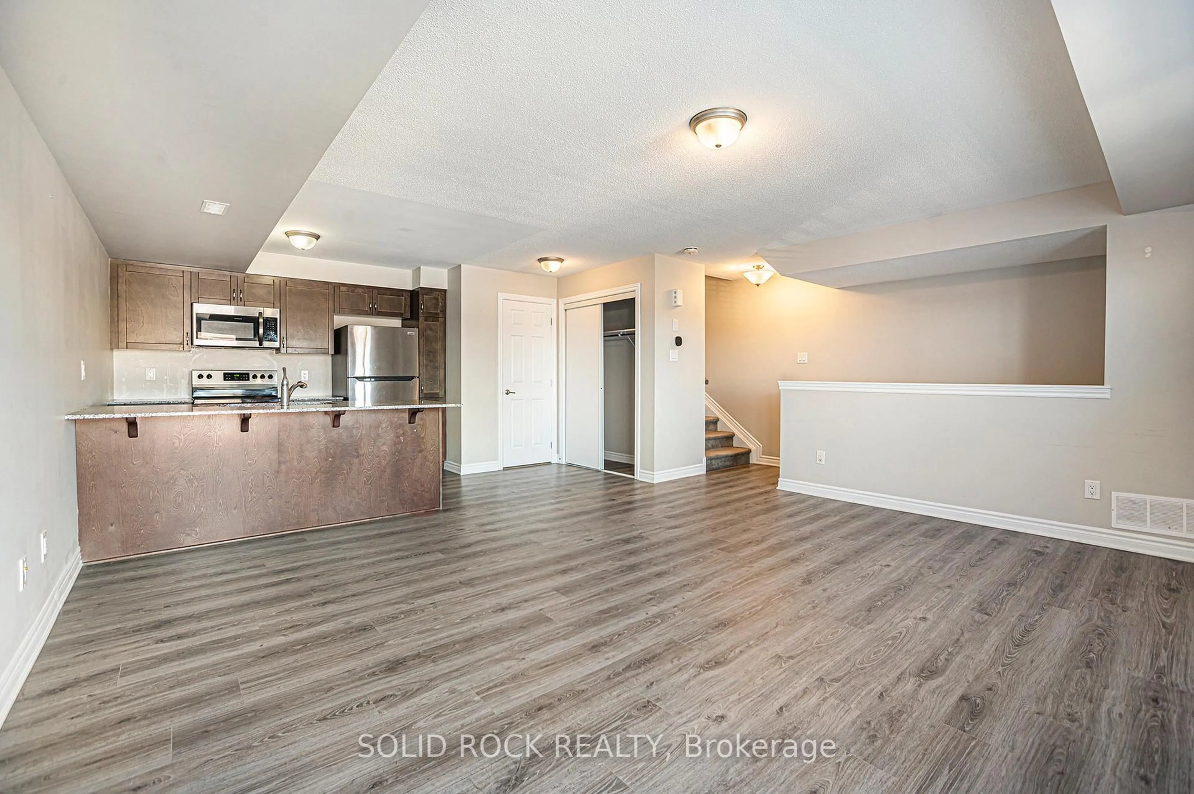Open concept kitchen, wood/laminate floor for 150 Walleye Private #42, Ottawa Ontario K2J 6R2