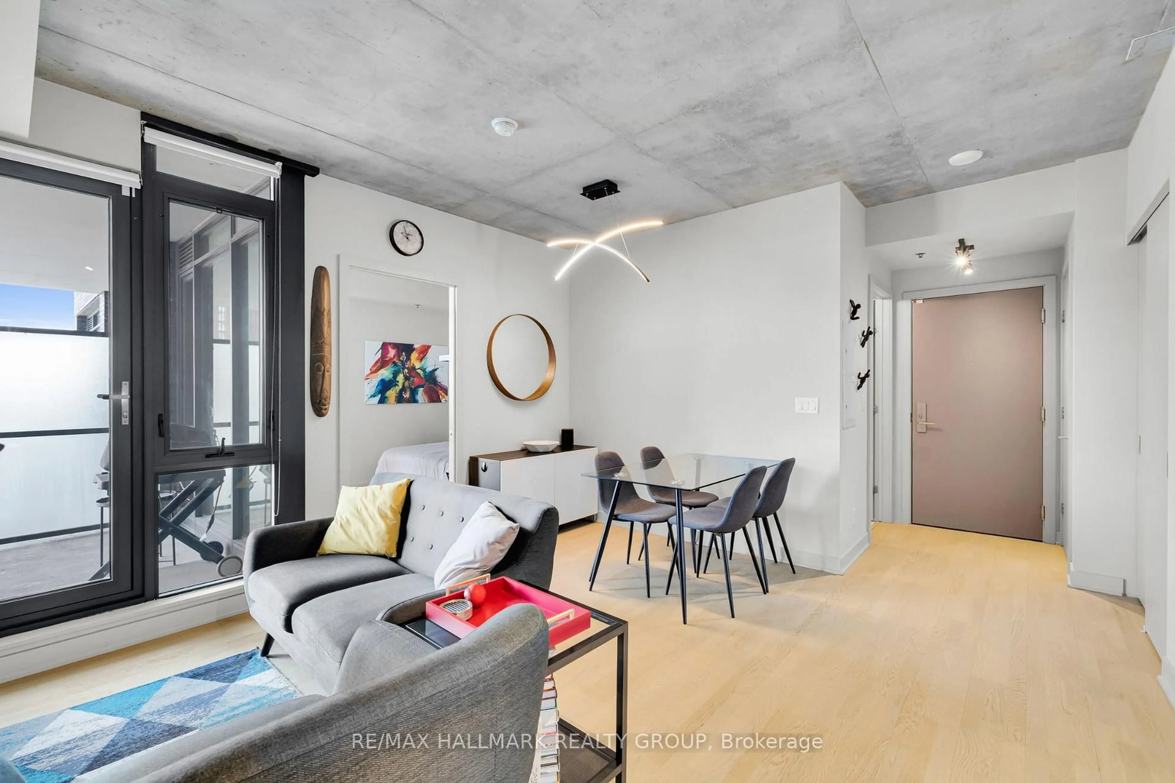 Living room with furniture, cement floor for 203 Catherine St #601, Ottawa Ontario K2P 1J5