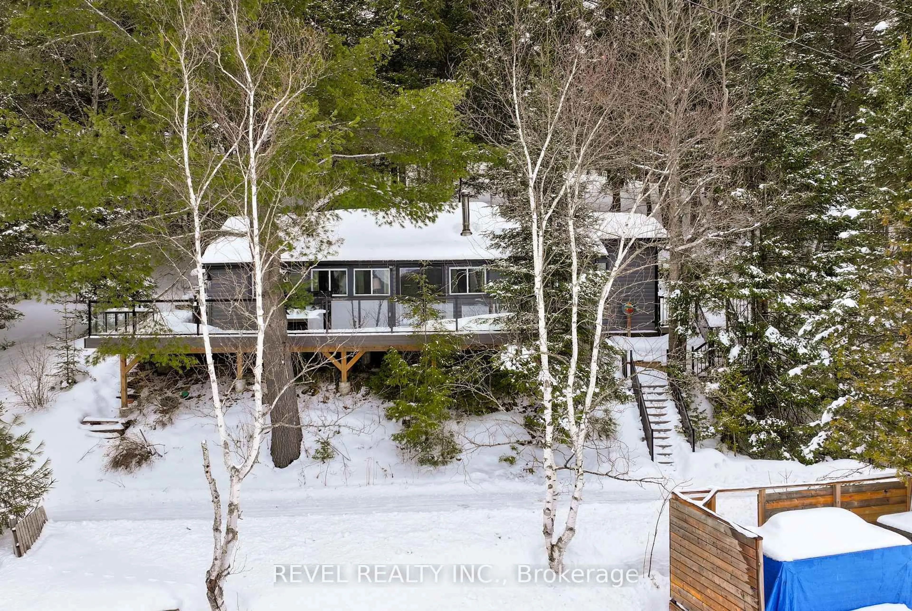 A pic from outside/outdoor area/front of a property/back of a property/a pic from drone, forest/trees view for 1129 LAKESHORE Rd, Highlands East Ontario K0M 1R0