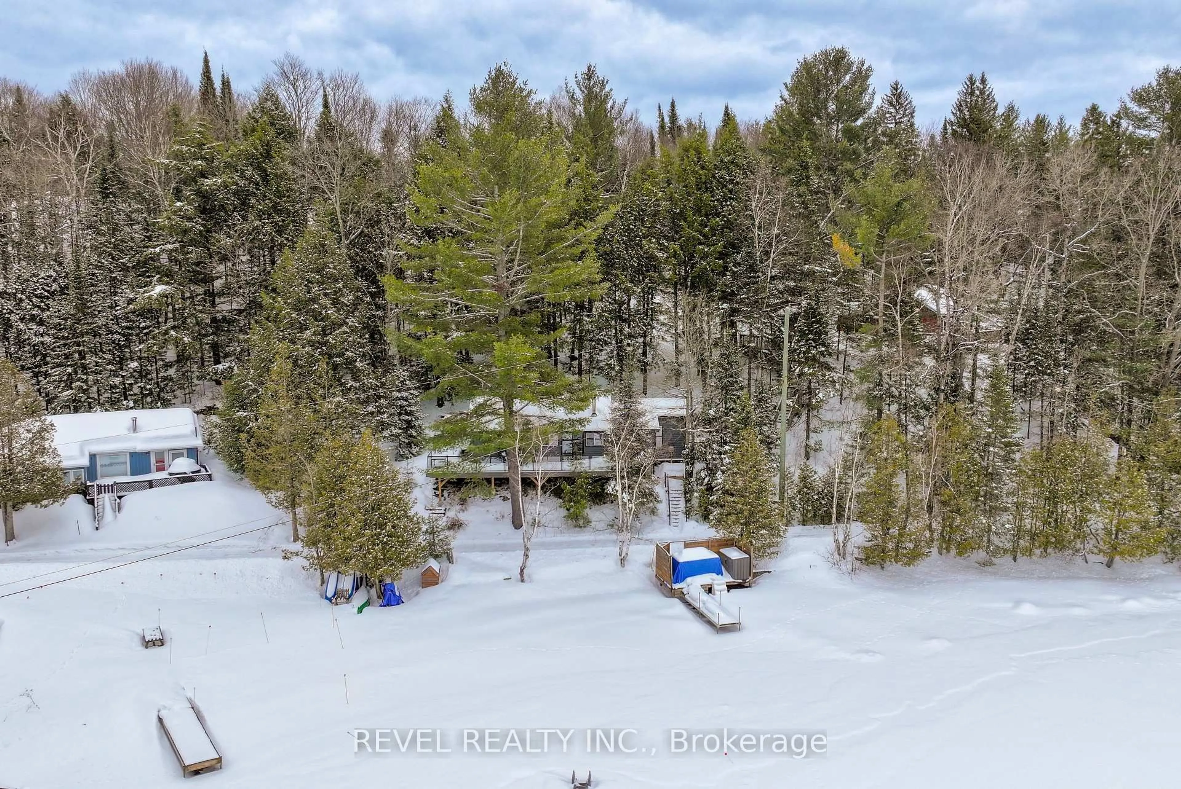 A pic from outside/outdoor area/front of a property/back of a property/a pic from drone, forest/trees view for 1129 LAKESHORE Rd, Highlands East Ontario K0M 1R0