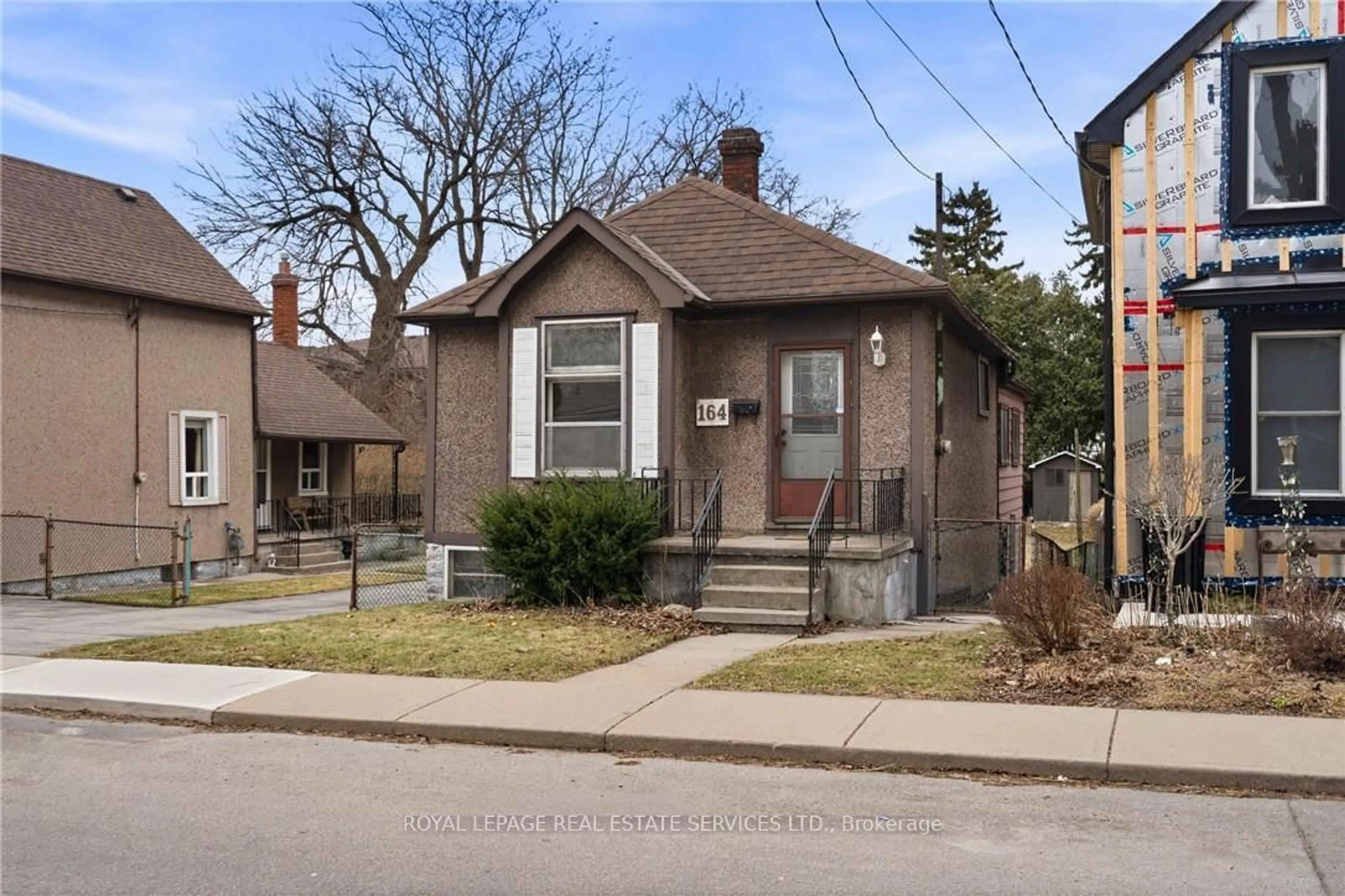 Home with brick exterior material, street for 164 and 170 Macaulay St, Hamilton Ontario L8L 3X6