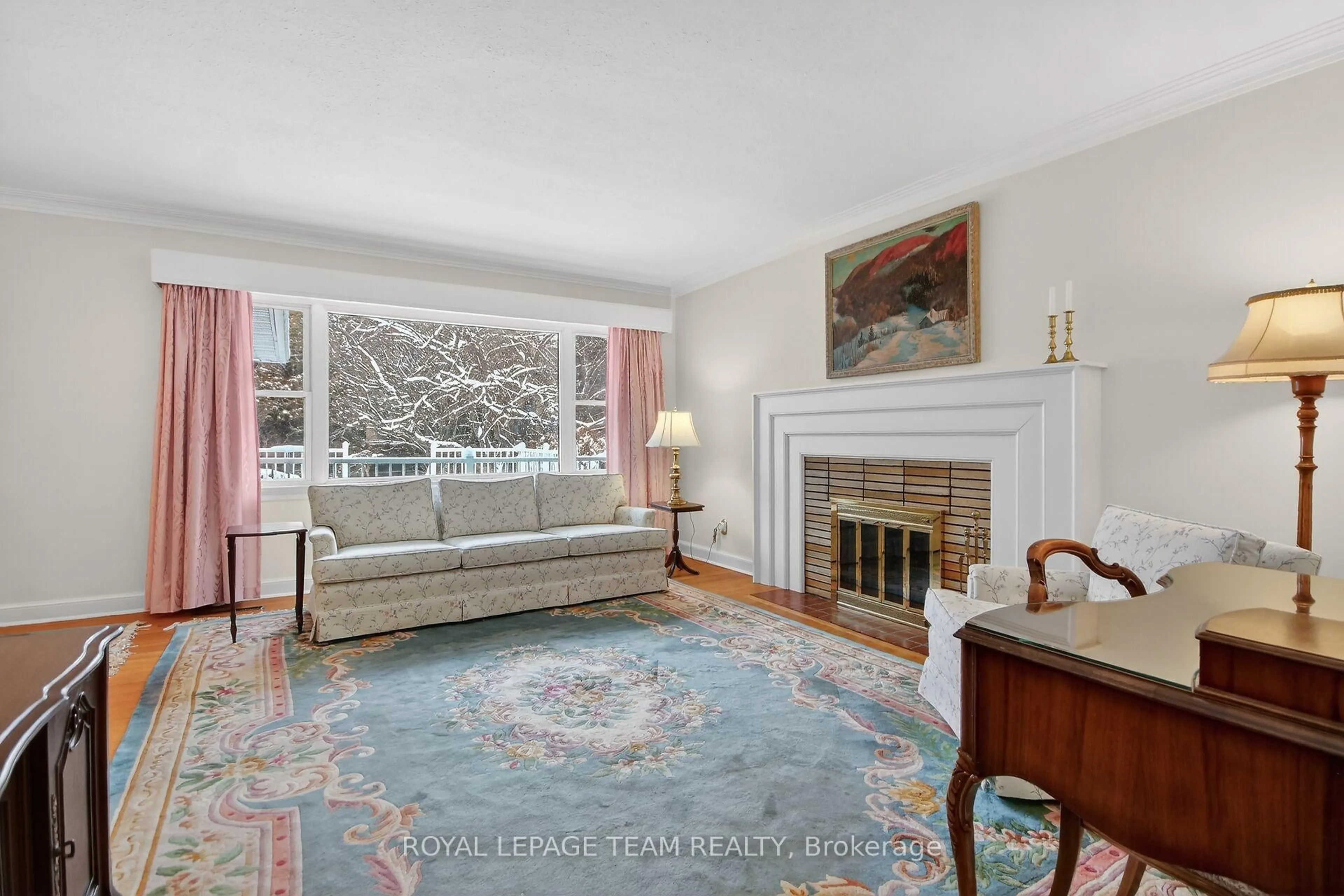 Living room with furniture, carpet floor for 825 Killeen Ave, Ottawa Ontario K2A 2X8